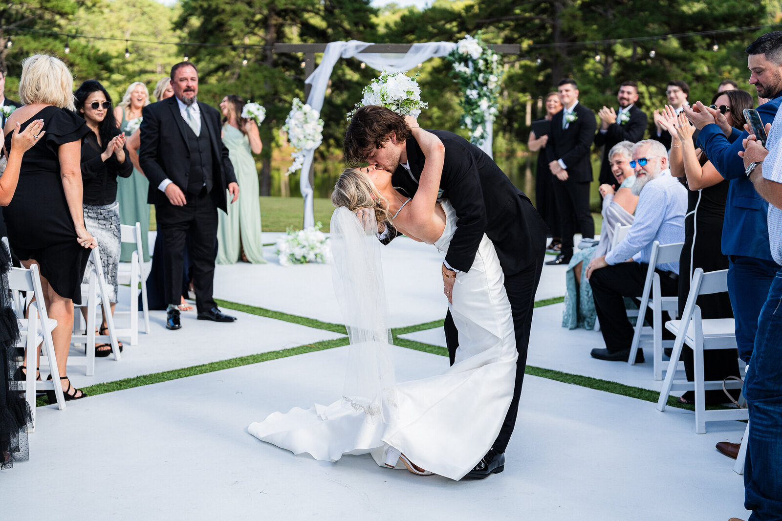 Groom is dipping his bride at the Venue Daisy Hill wedding venue 
