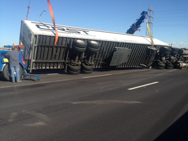 Petroff rotator tow trucks on IL and MO bridge rollover tractor trailer accident