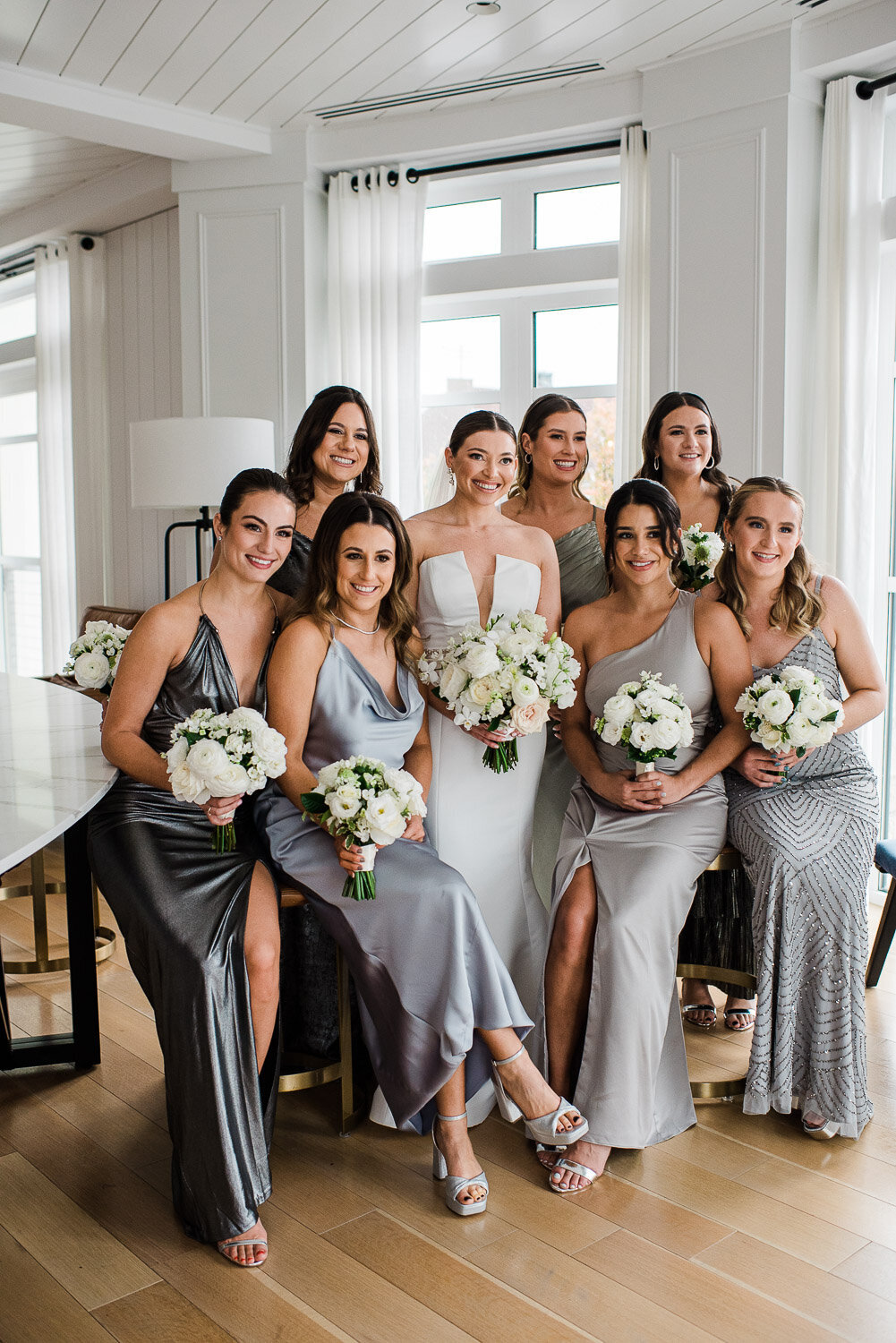 bride and bridesmaid formal group photo inside