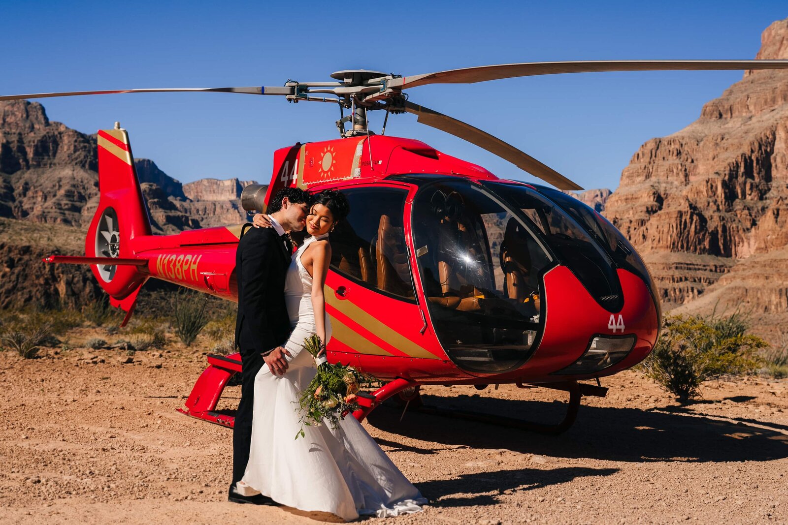 Couple enjoying the view during their helicopter elopement in Grand Canyon.