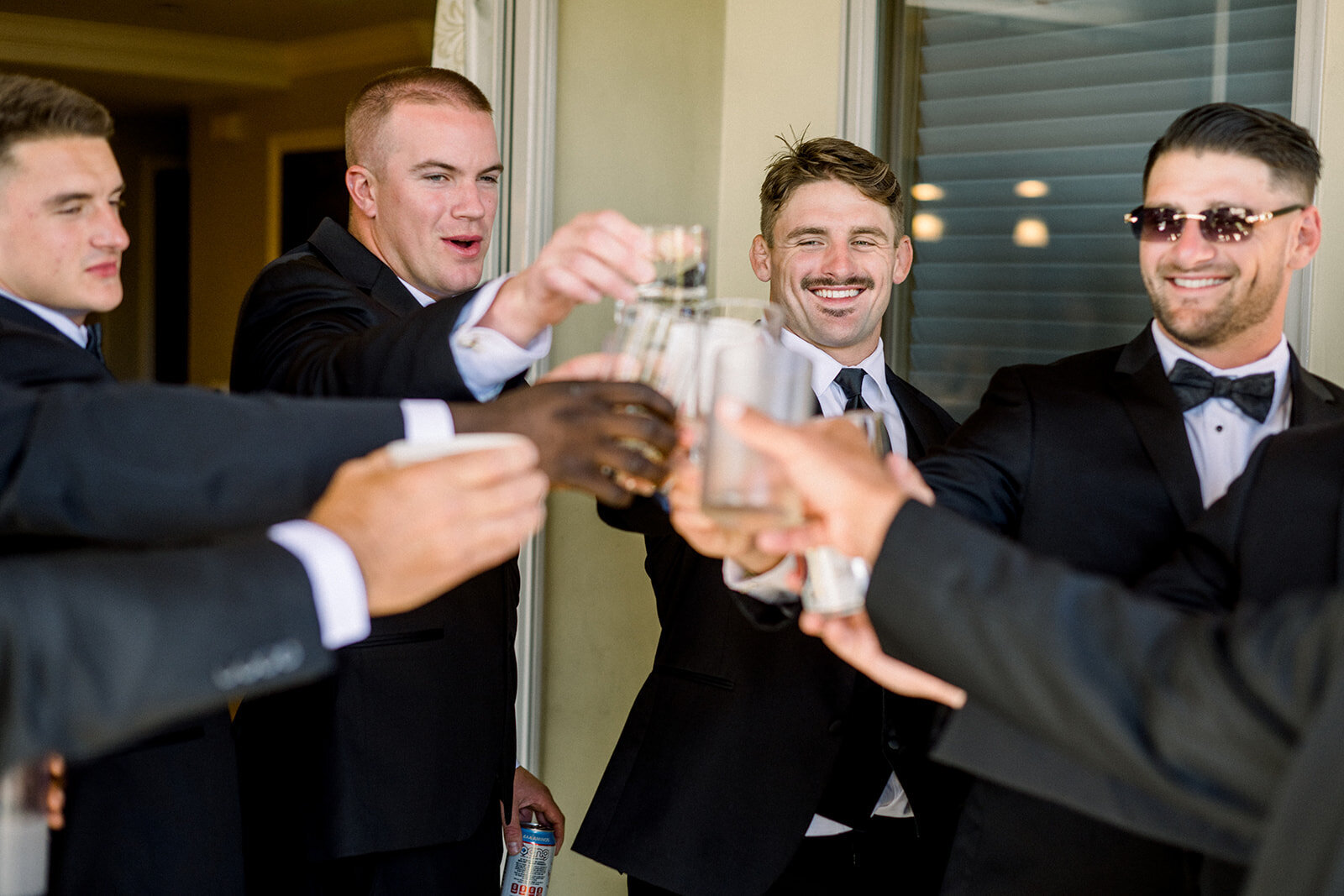 Groom and Groomsmen Toasting at Dolphin Bay Resort Wedding
