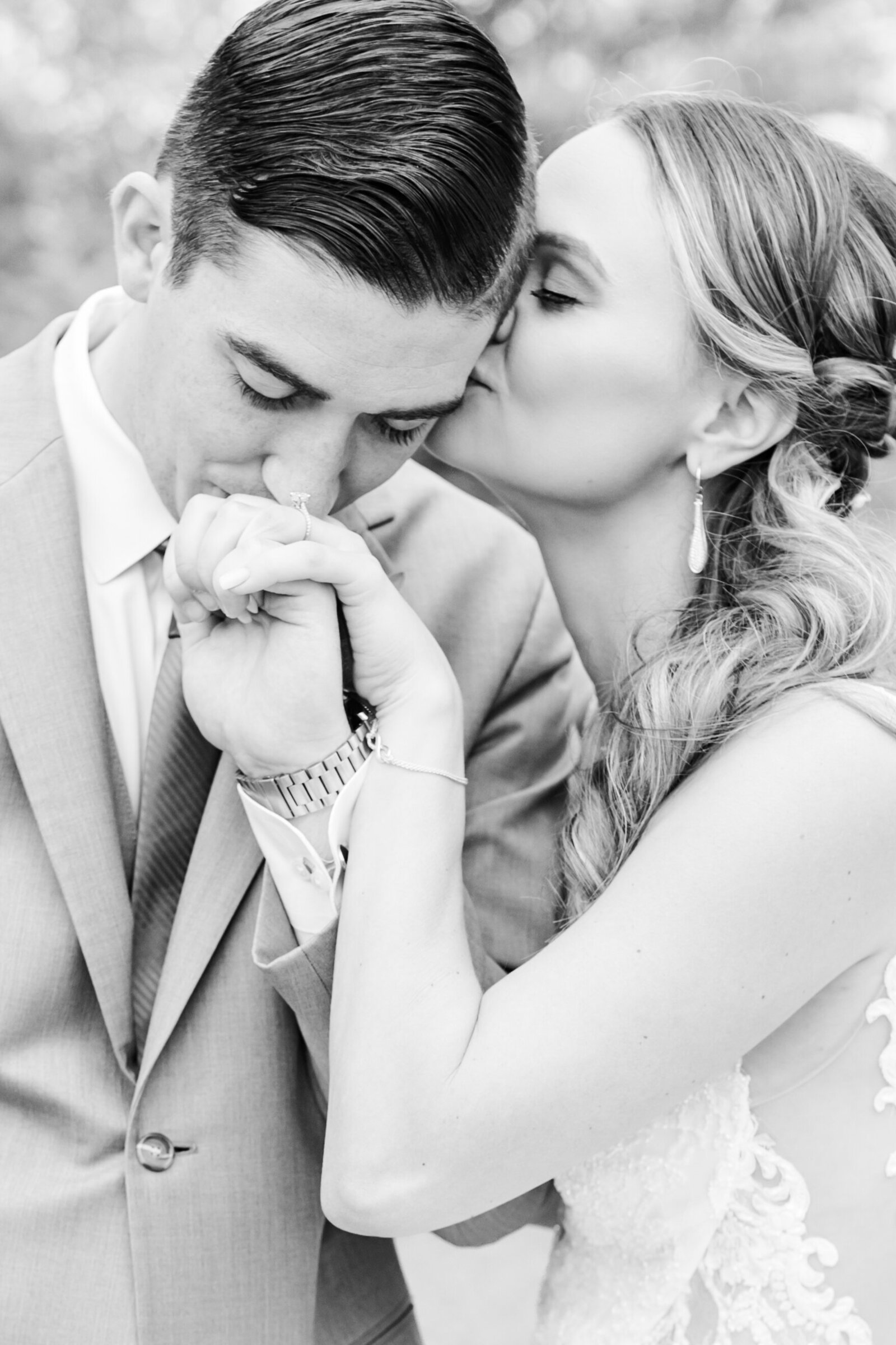 3_groom_kissing_hand_wedding_at_overture_center_madison_wisconsin
