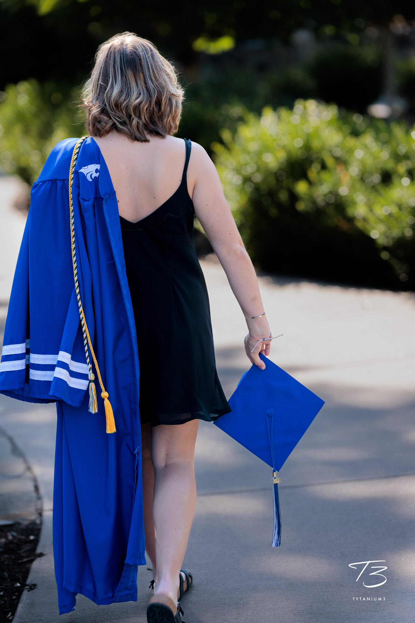 Girl walking away in gown