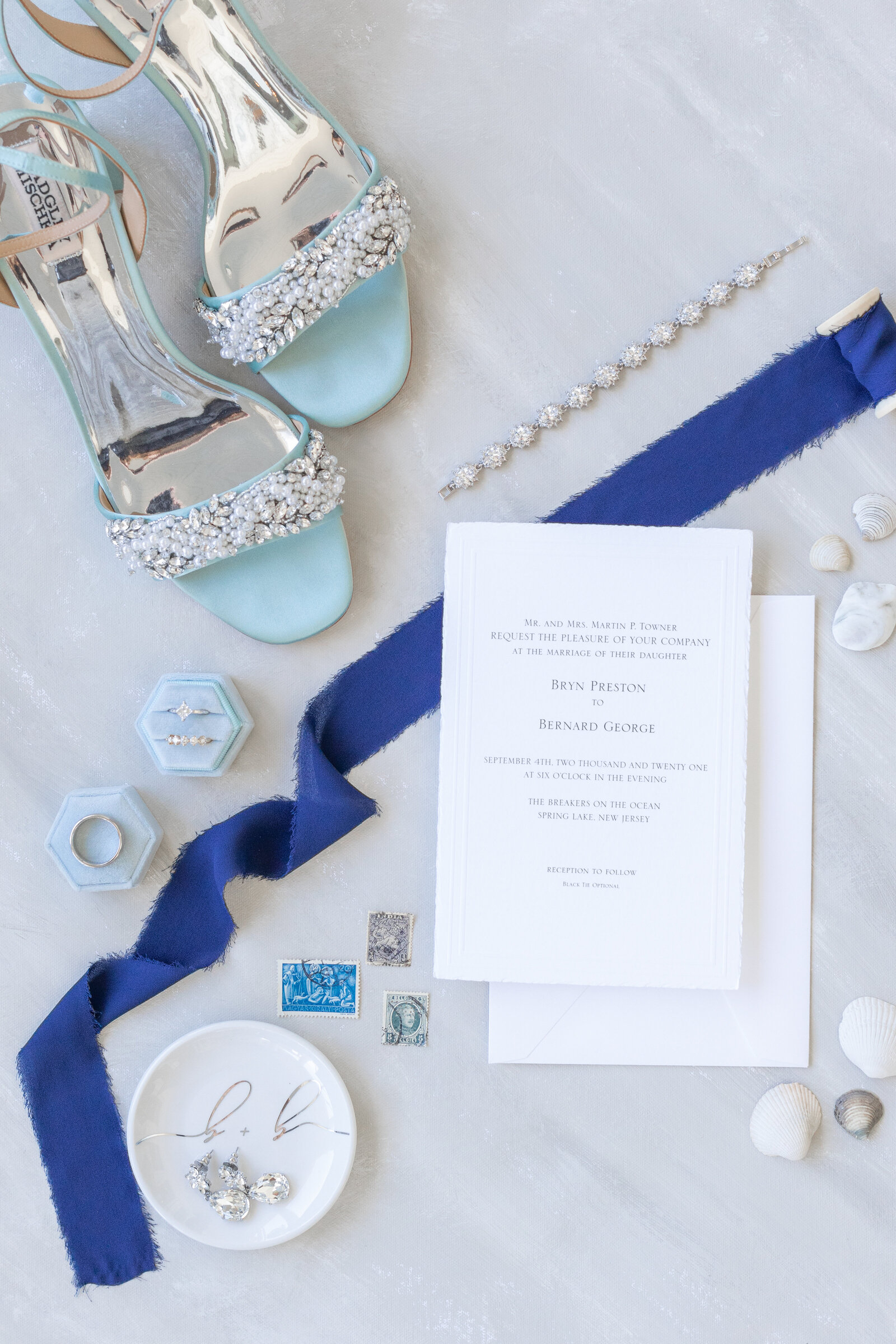 blue wedding flatlay invitation suite shoes rings The Breakers Spring Lake