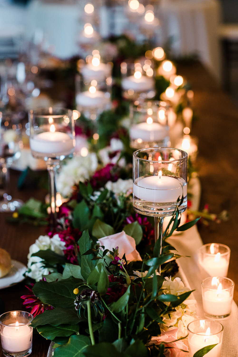 candle and vibrant floral table top