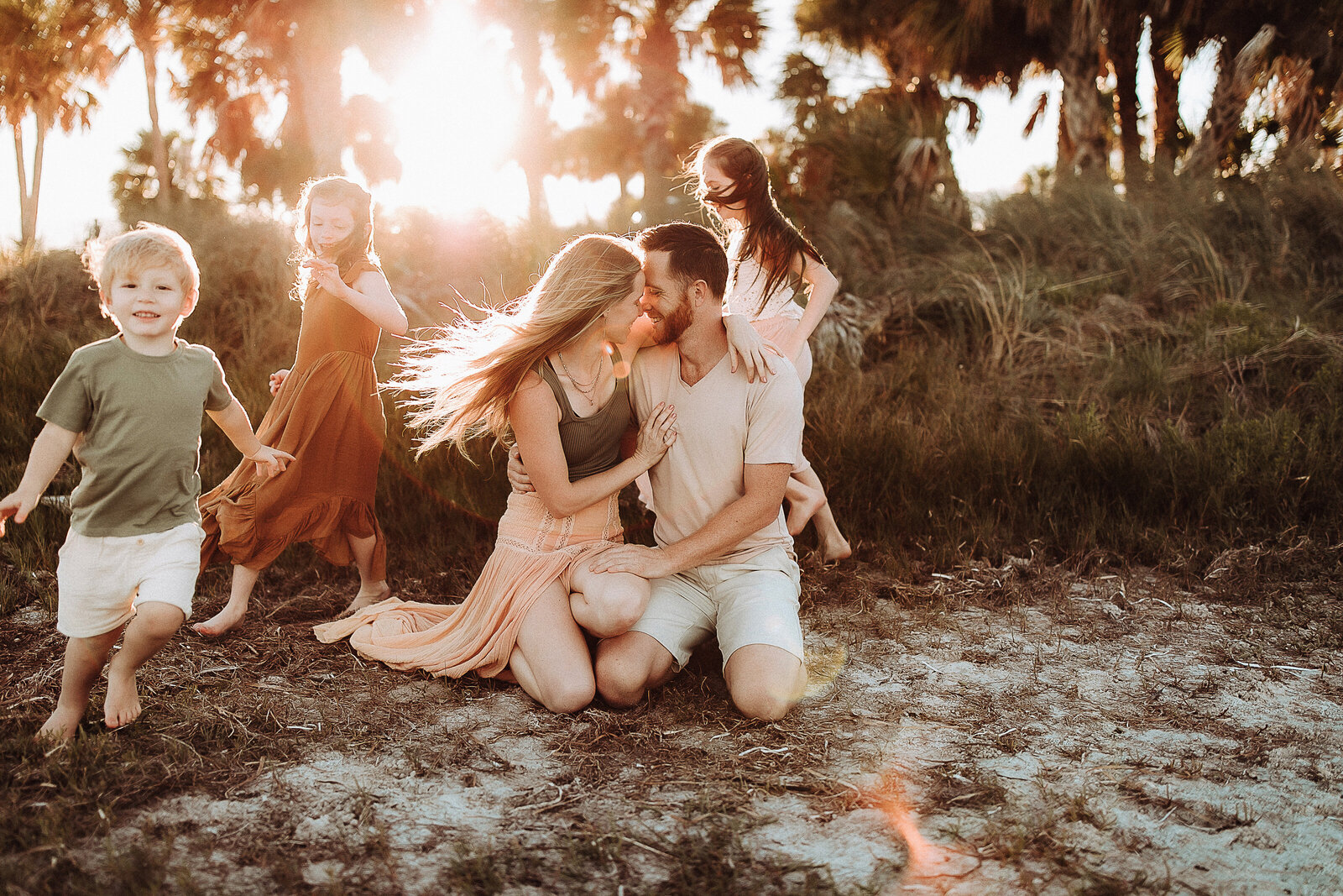 windy-playful-candid-family-five-children-beach