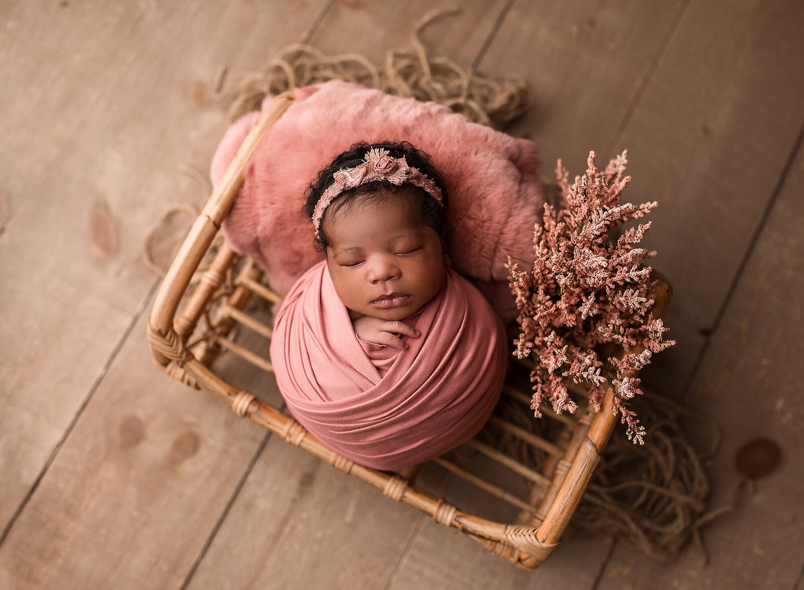african baby girl wrapped in pink