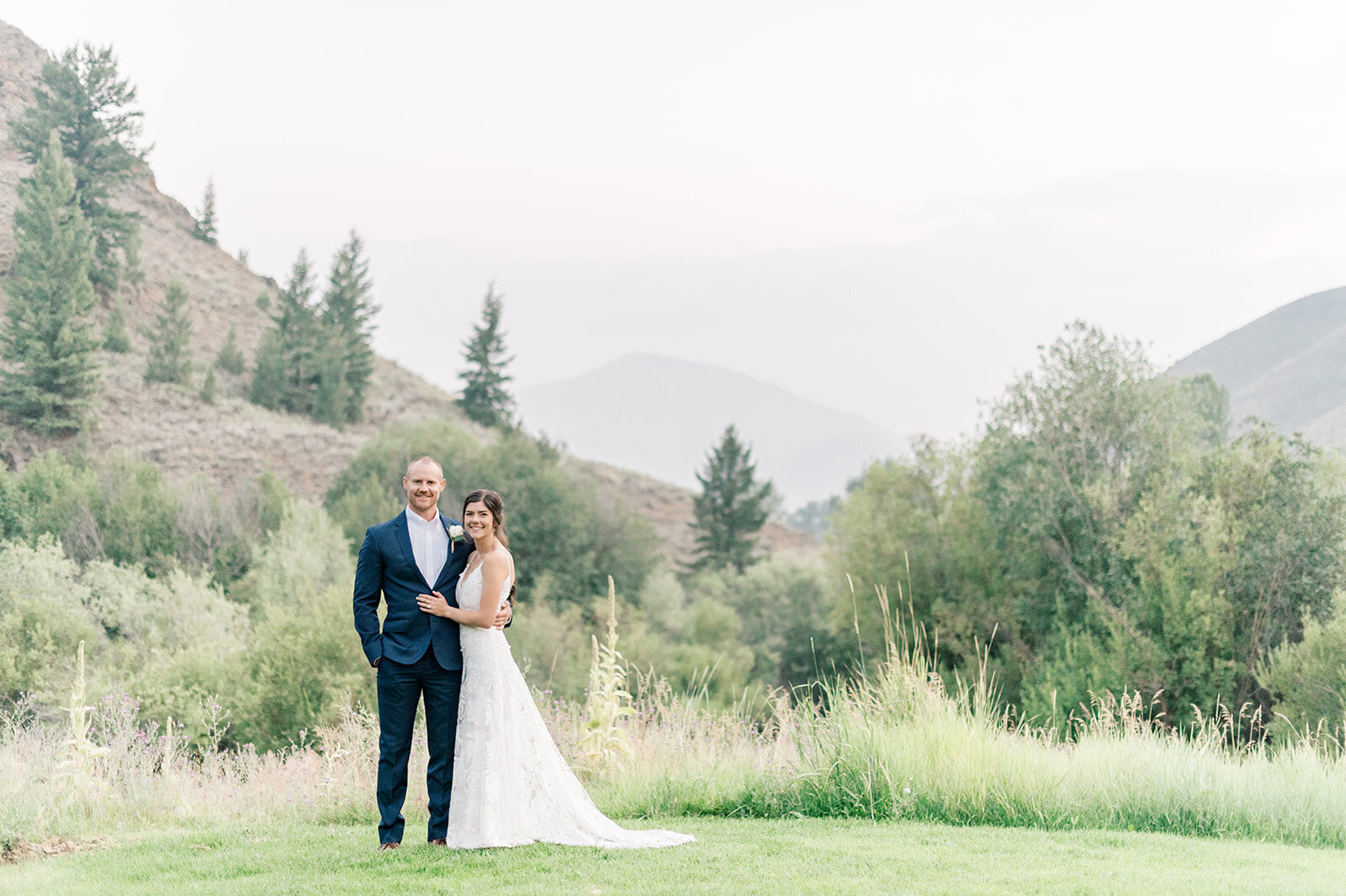 Bride and groom posing in front of Baldy at Trail Creek Cabin Wedding taken by the Best Sun Valley Wedding Photographers
