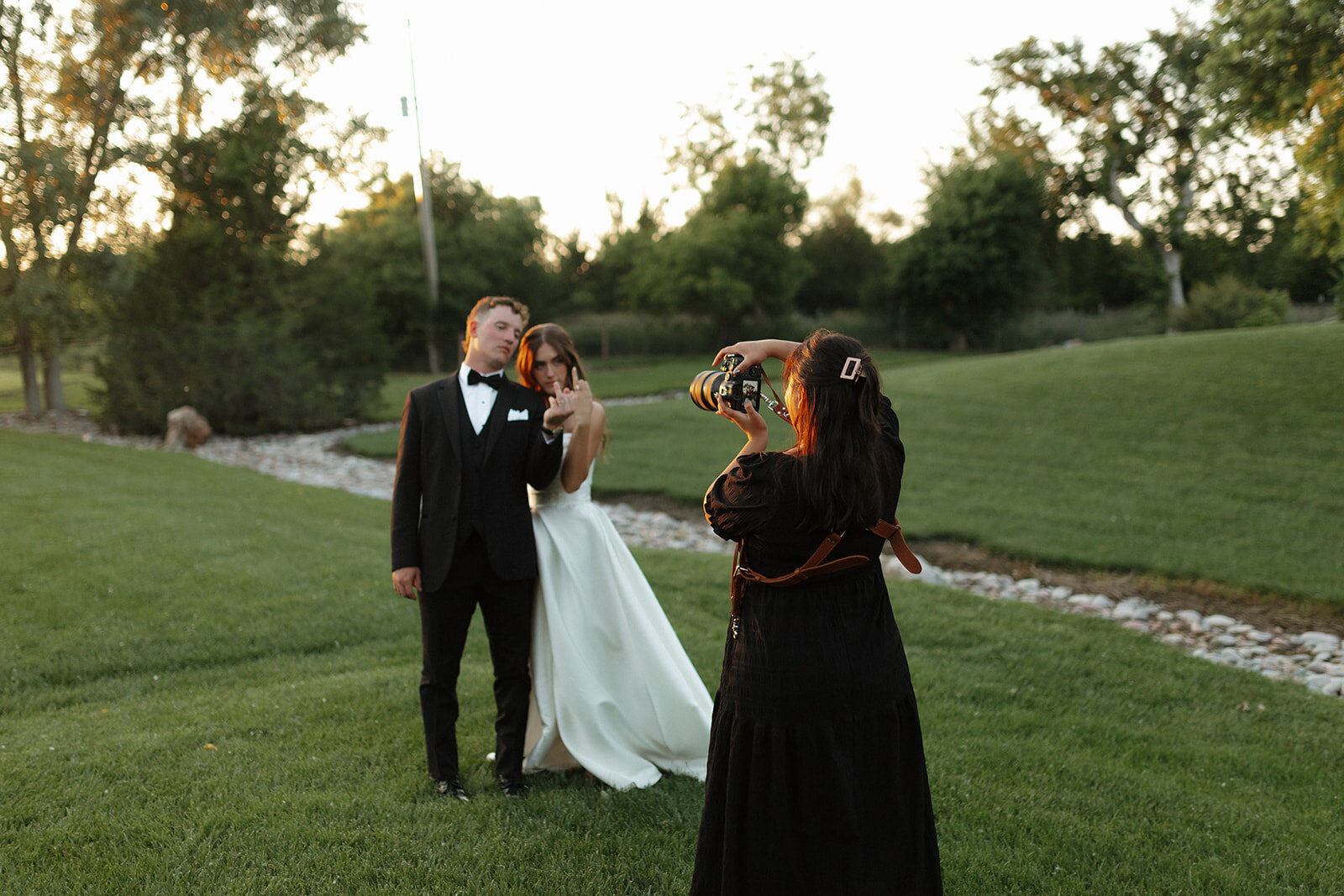 A bride and groom gazing out at the breathtaking view of Officers Gulch Pond and the surrounding mountains in Breckenridge, Colorado, capturing a peaceful and intimate moment amidst the stunning natural beauty.