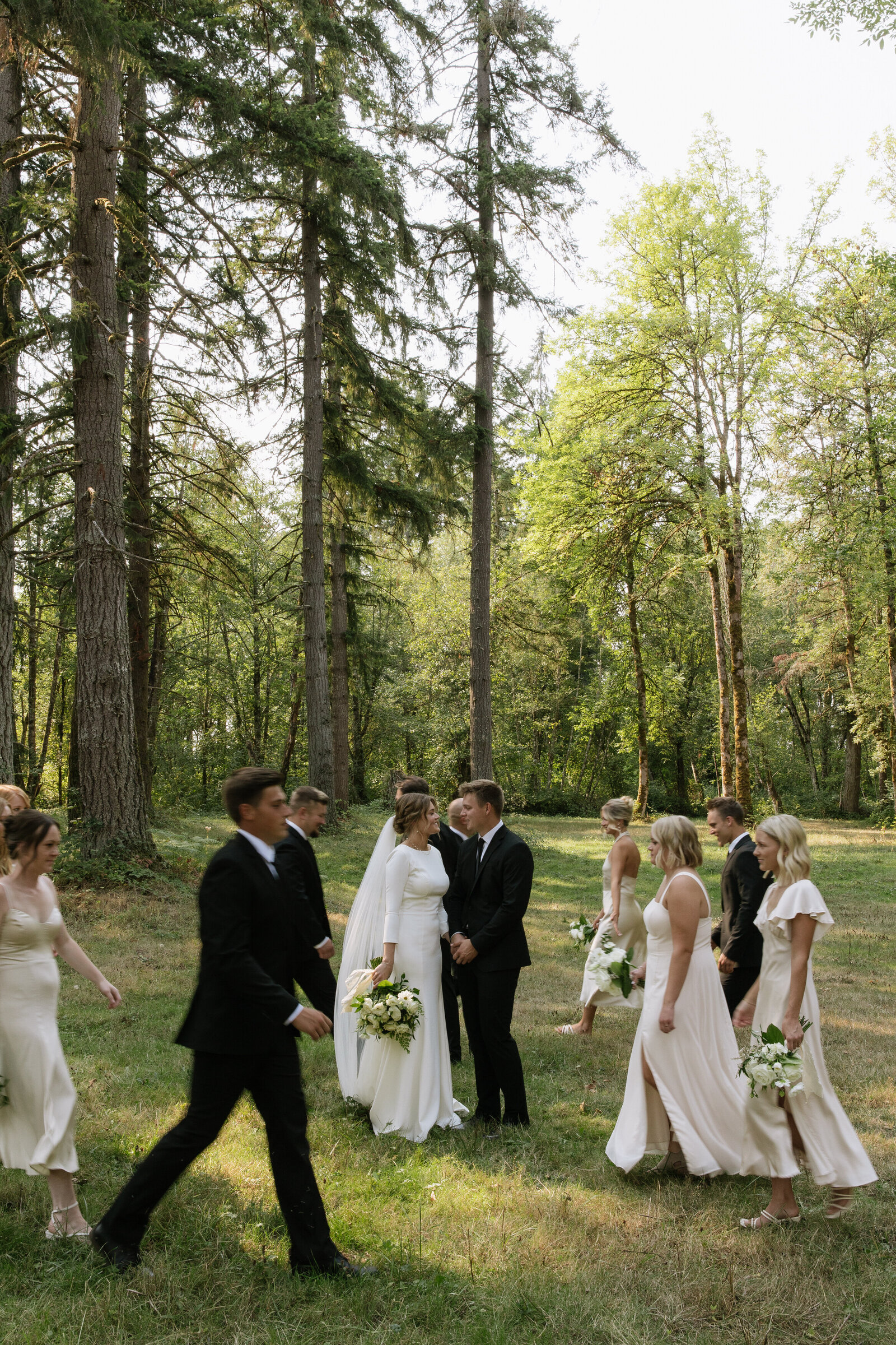 Adventure elopement couple with bridal party on forest trail in Washington
