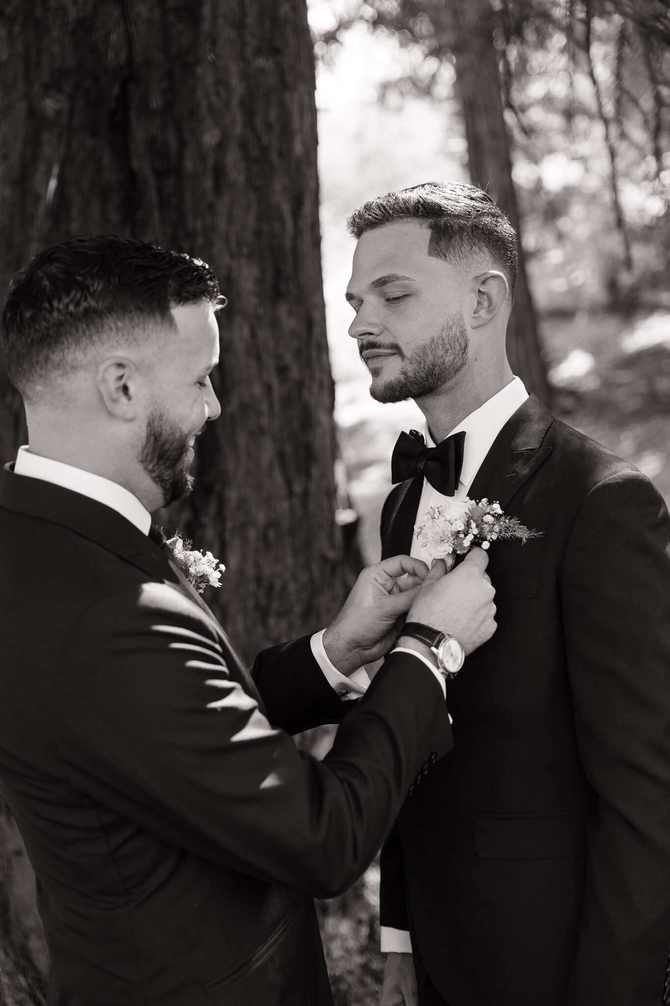 Grooms fixing tie by Northern California wedding photographer