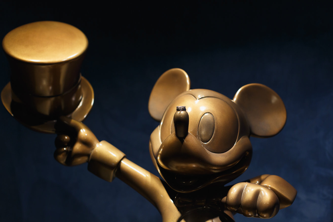 Wedding rings balanced on Mickey statues nose