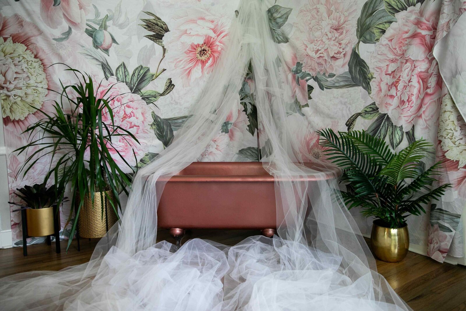 studio photography set - clawfoot bathtub with tulle, plants, floral wallpaper
