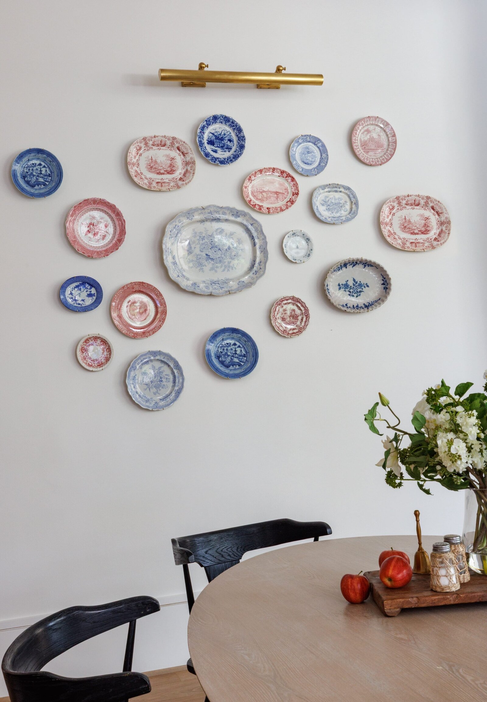 vision and hammer interior design red and blue china plates displayed on wall