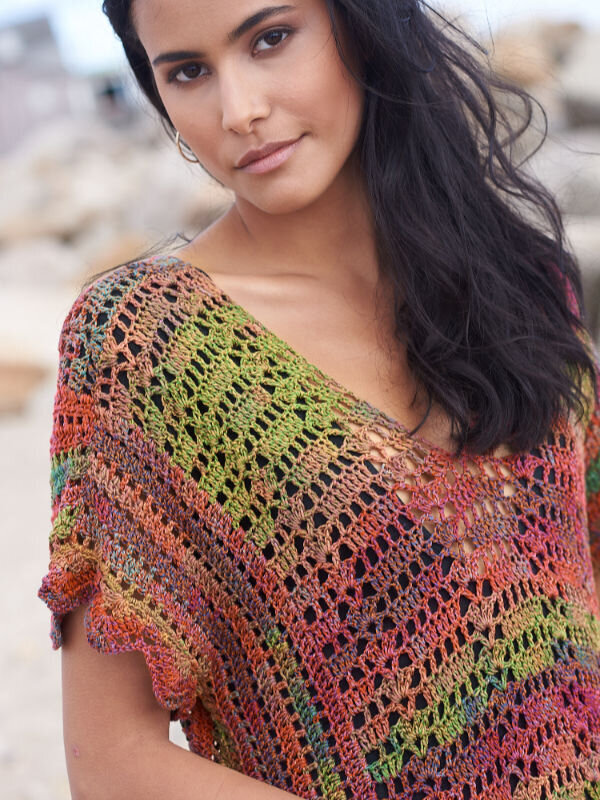 Natural makeup for a model in a multi colored sweater