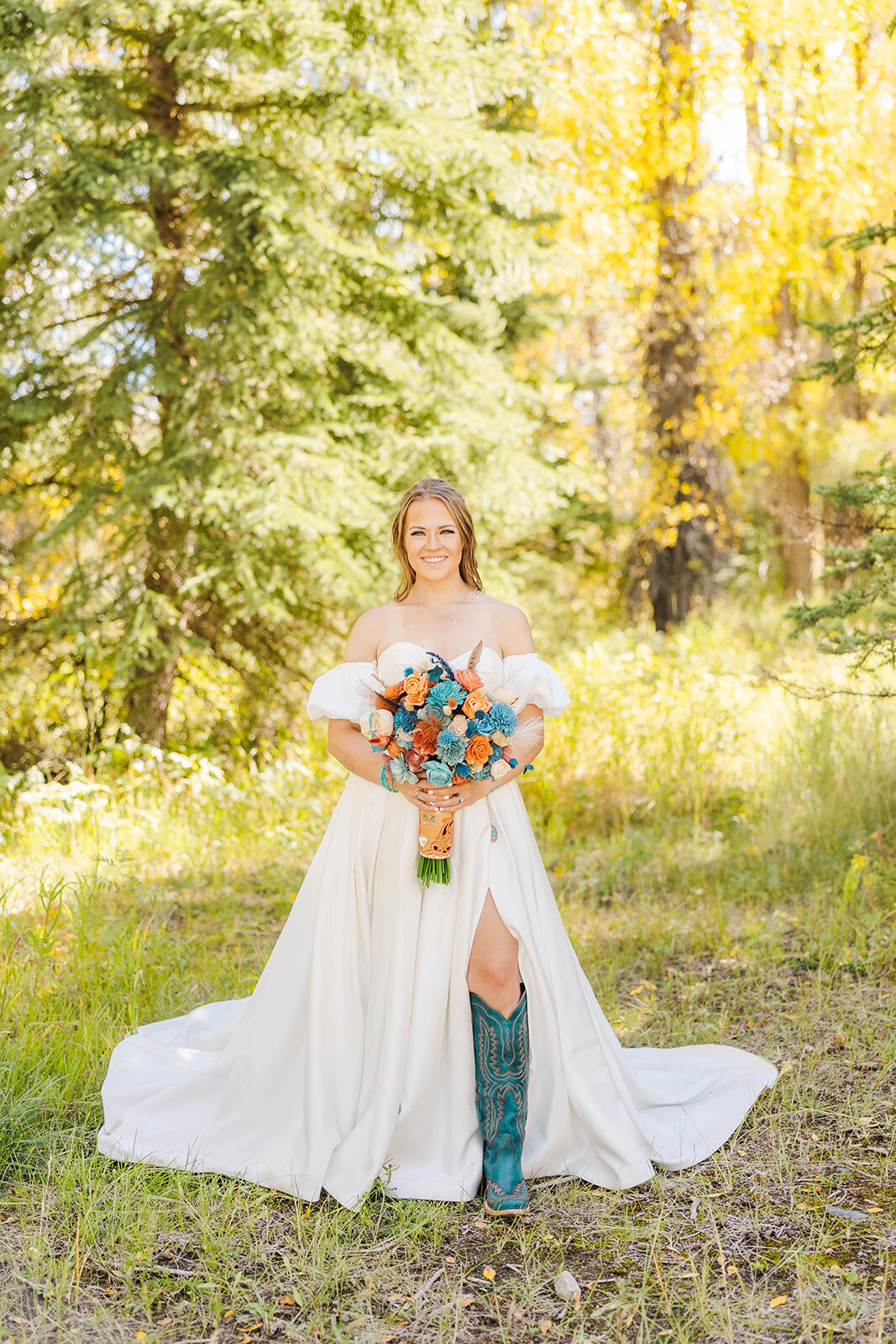 Bride posing with her bouquet and wedding dress at her elopement in Jackson, Wyoming.