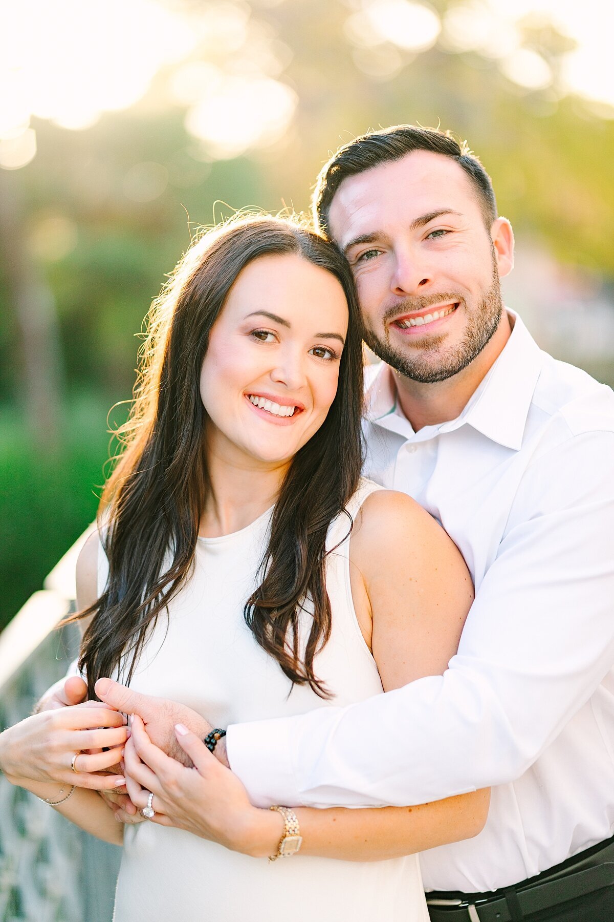 Bride and groom smiling for an engagement portrait in Balboa Park.