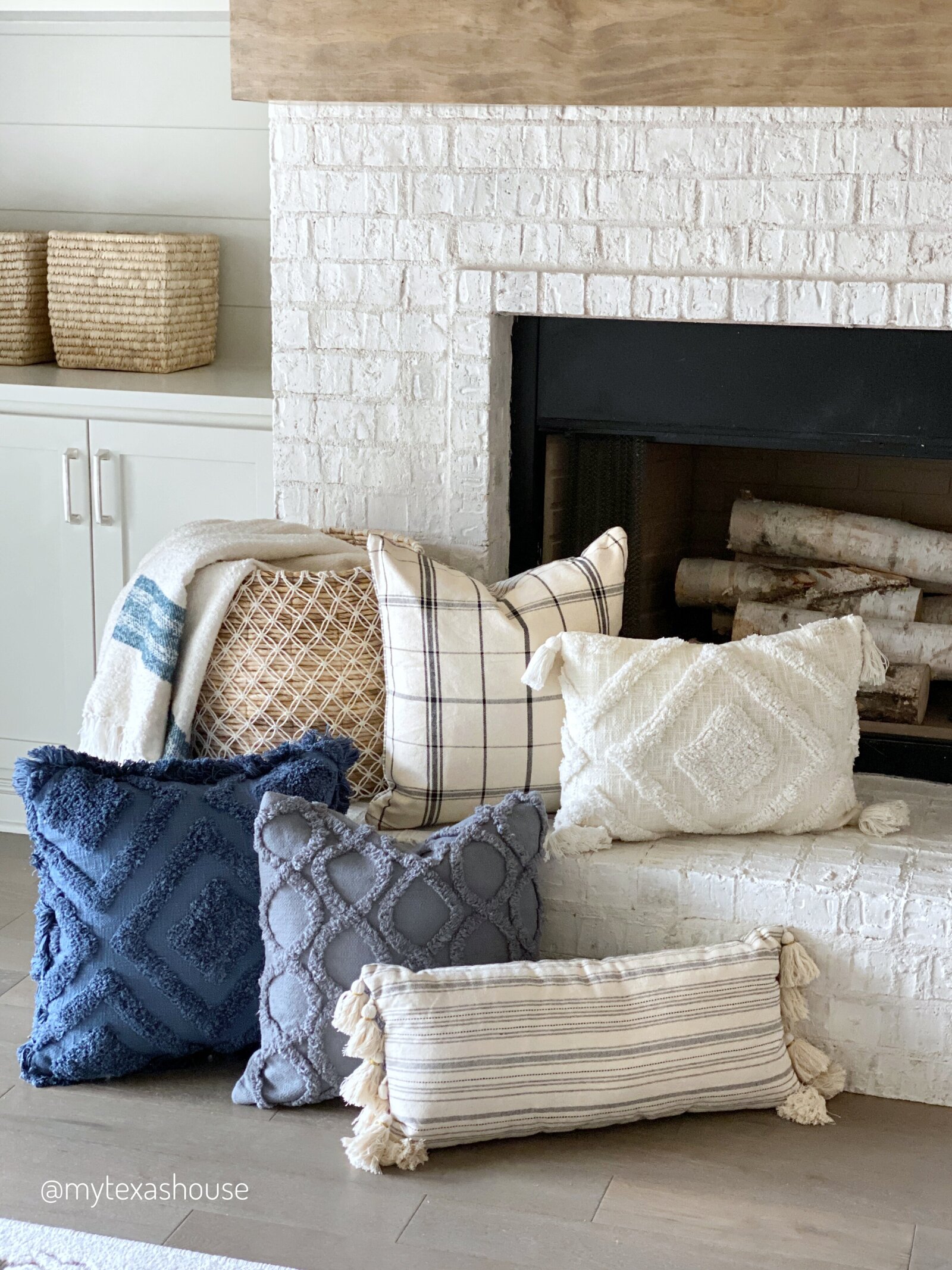 Fireplace decorated with MTH pillows and throw