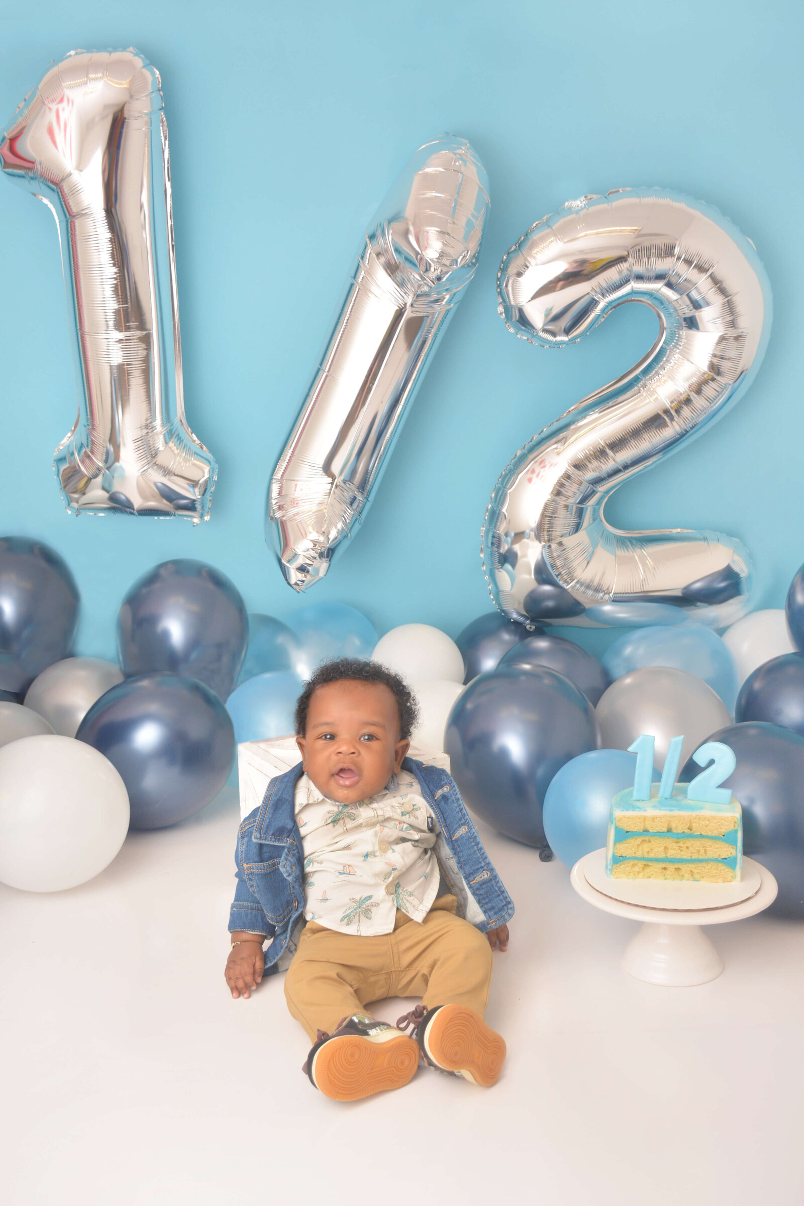 boy at a 1/2 birthday photoshoot