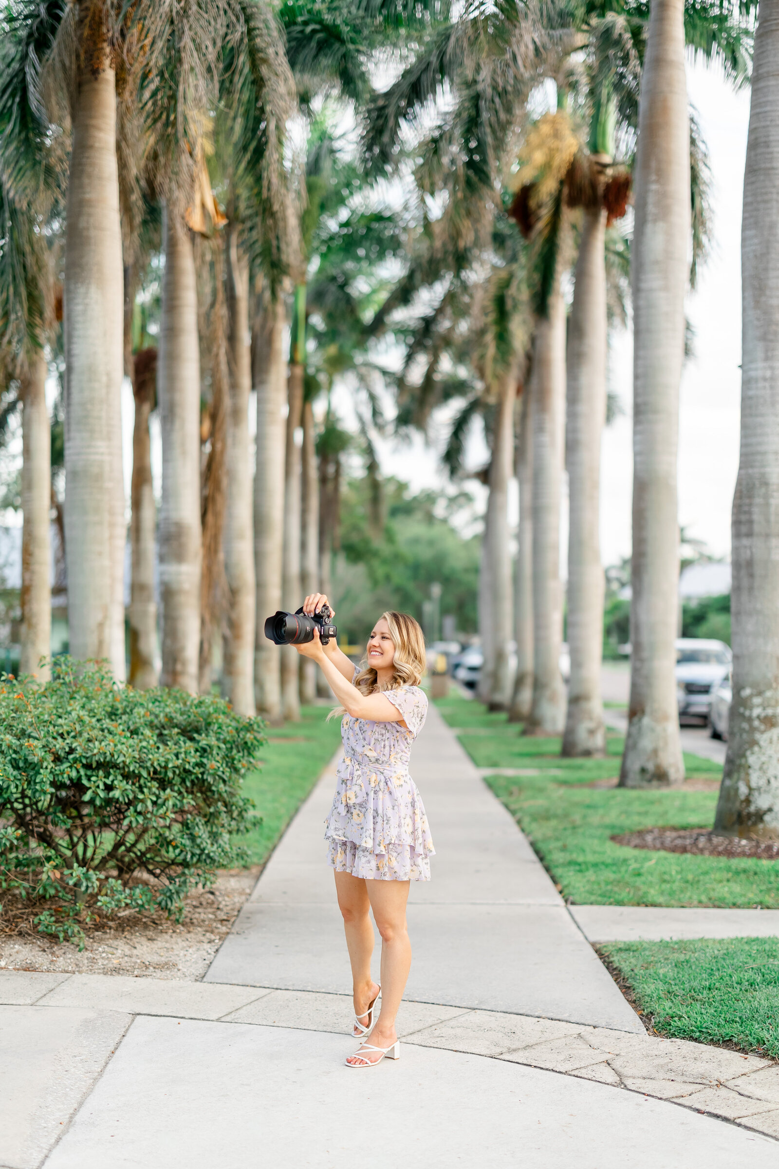 central florida wedding photographer photographing with her camera