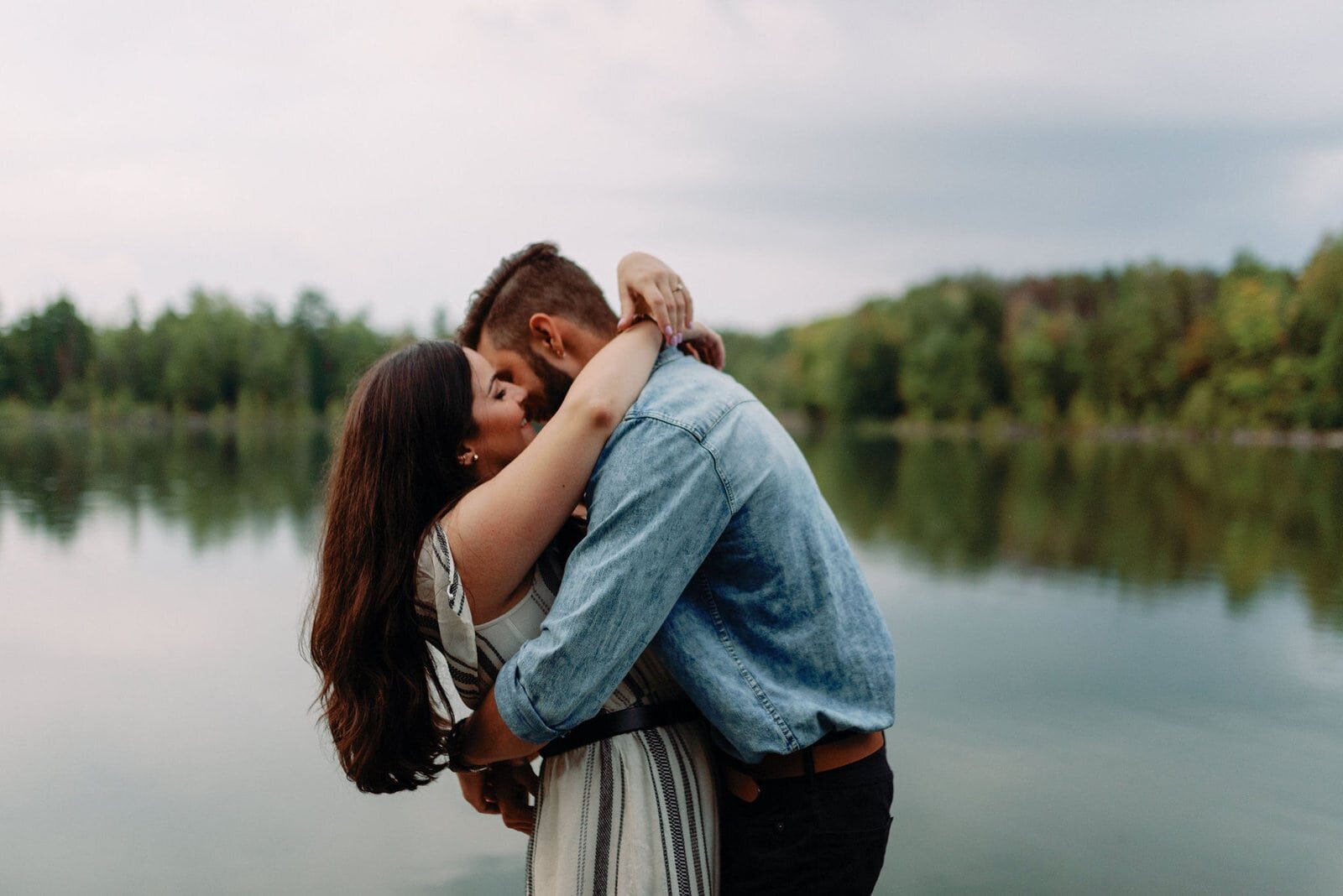 Romantic Stormy Engagement Photos Toronto couple romantic embrace stormy engagement photos toronto jacqueline james photography rowboats the notebook storm clouds Toronto Wedding Photographer Jacqueline James Photography