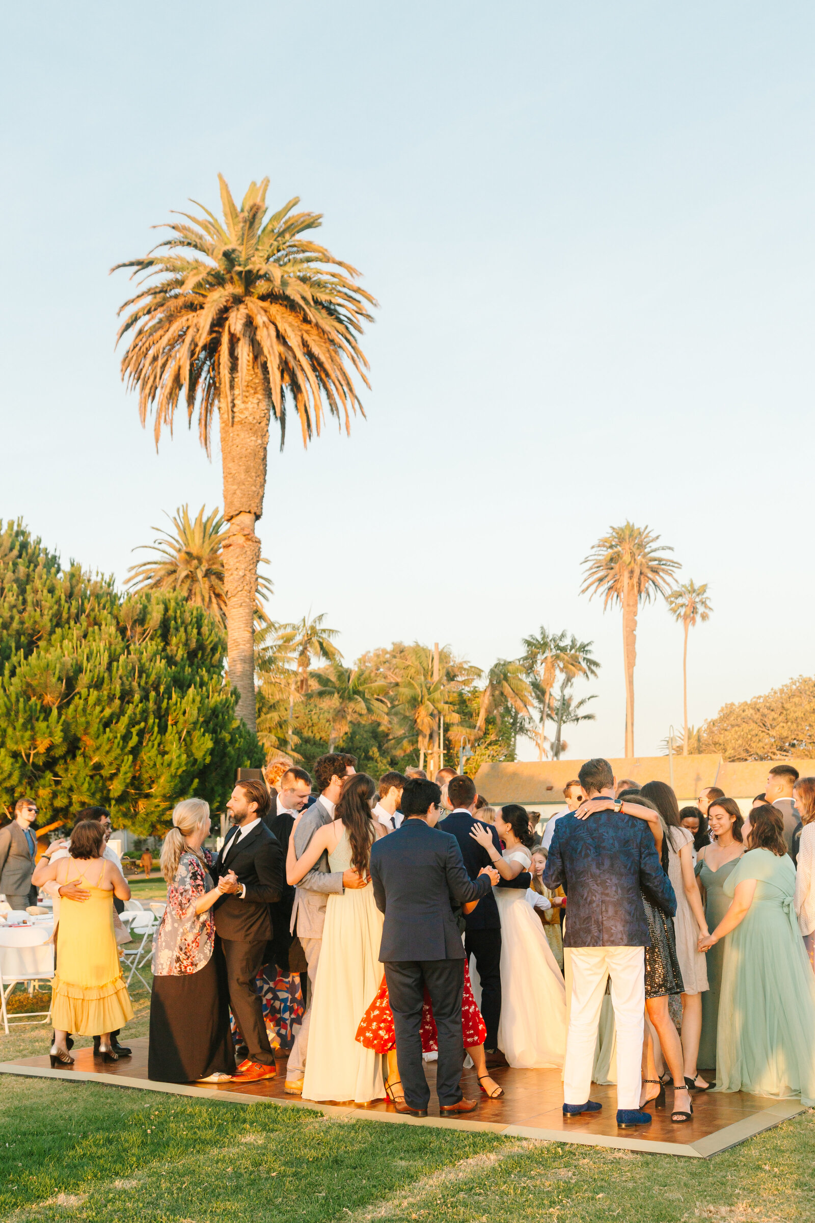 Reception in Los Angeles underneath palm trees.