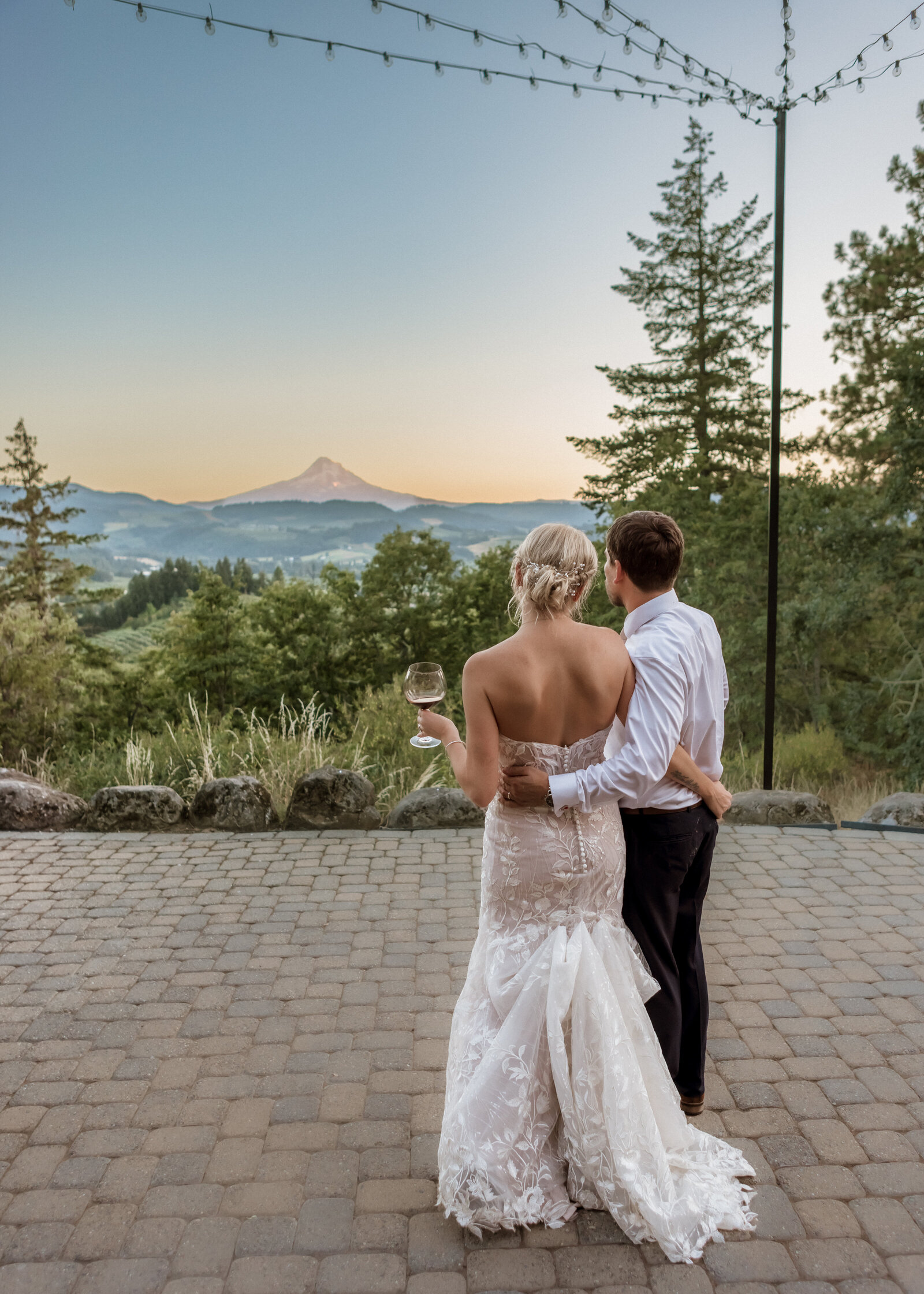 Couple taking in the view at The Crag Rat Hut at Sunset in Hood River, Oregon.