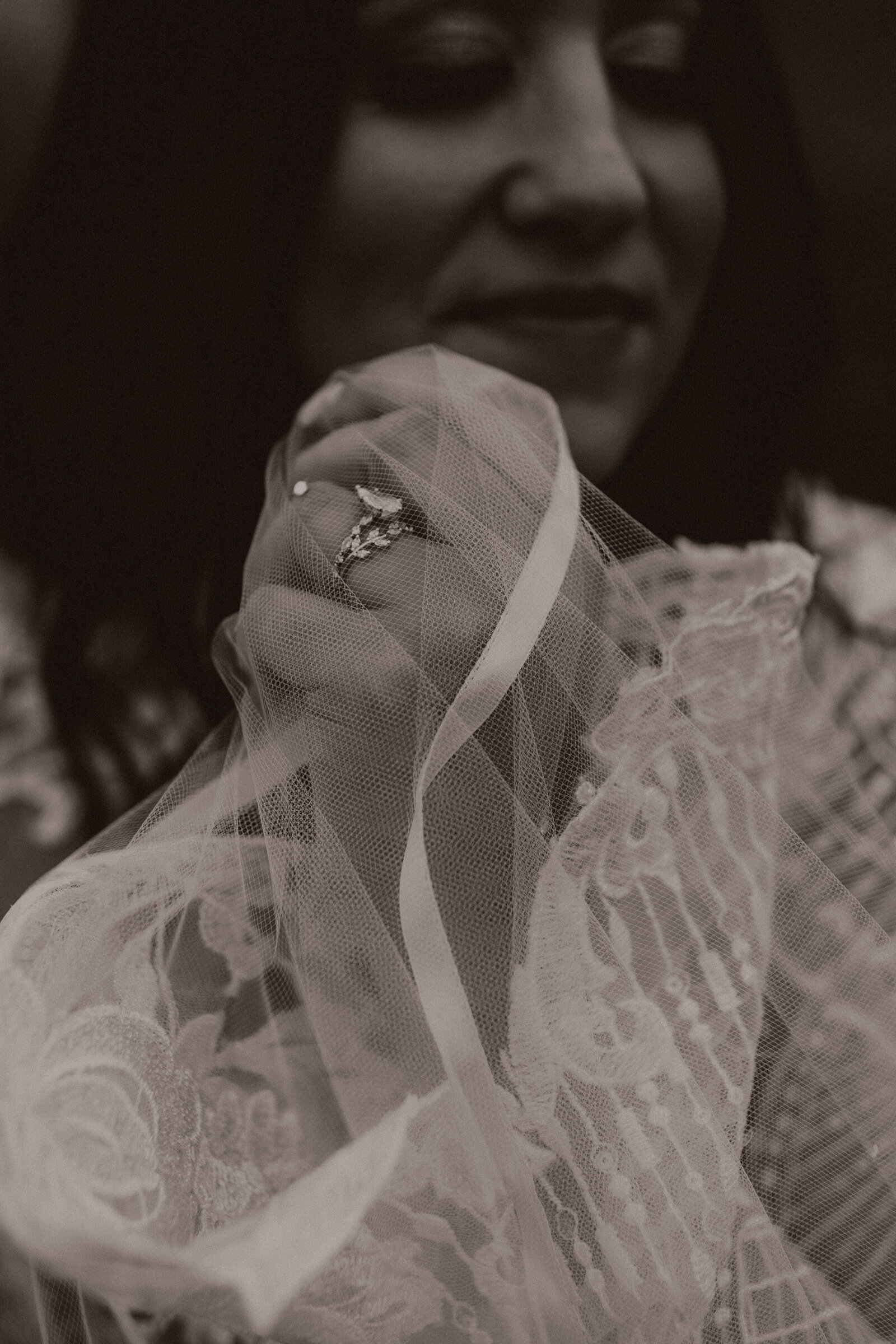 hand photo of brides ring and veil during Madison, Wisconsin wedding