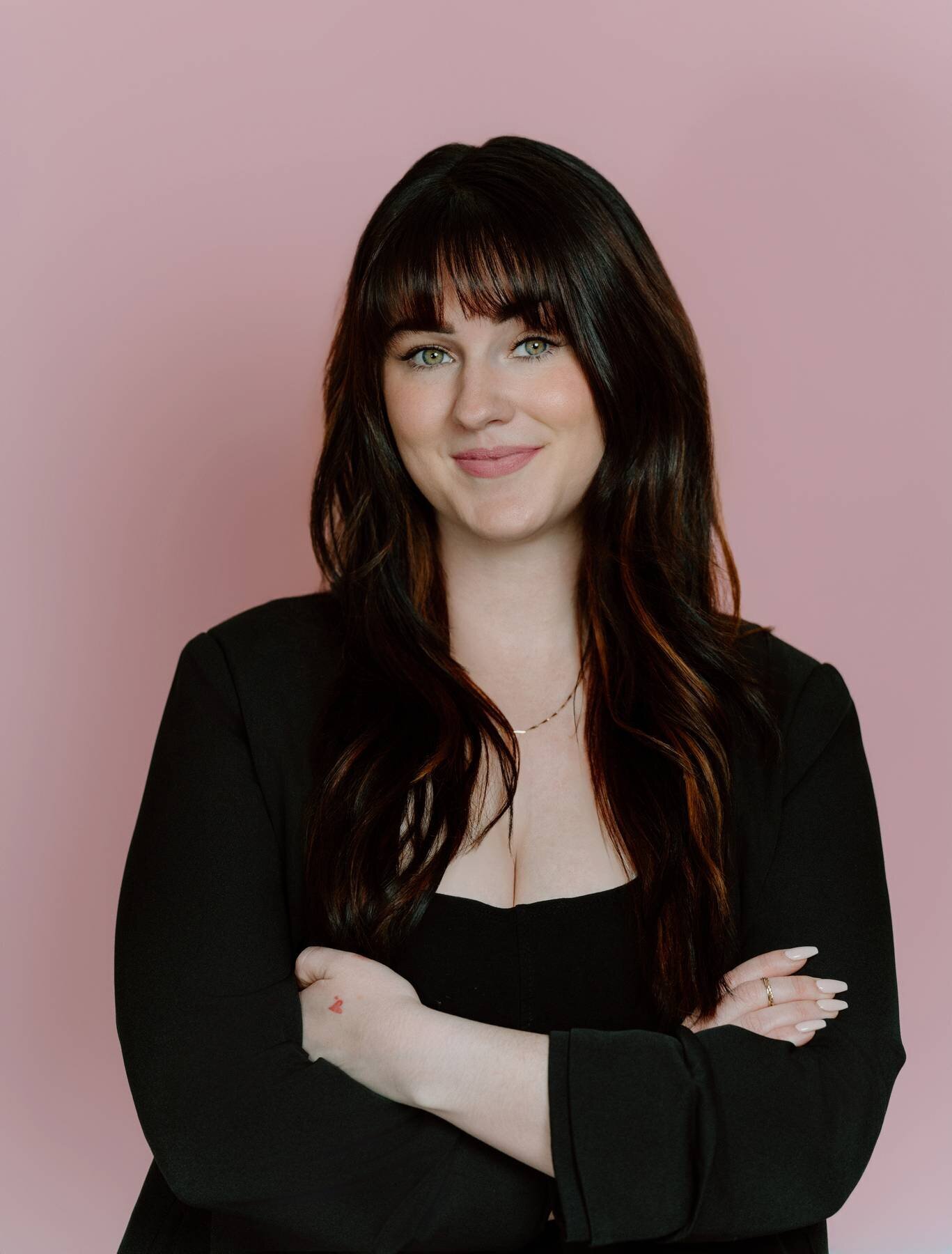 Studio headshot of a successful woman, showcasing her achievements and confidence