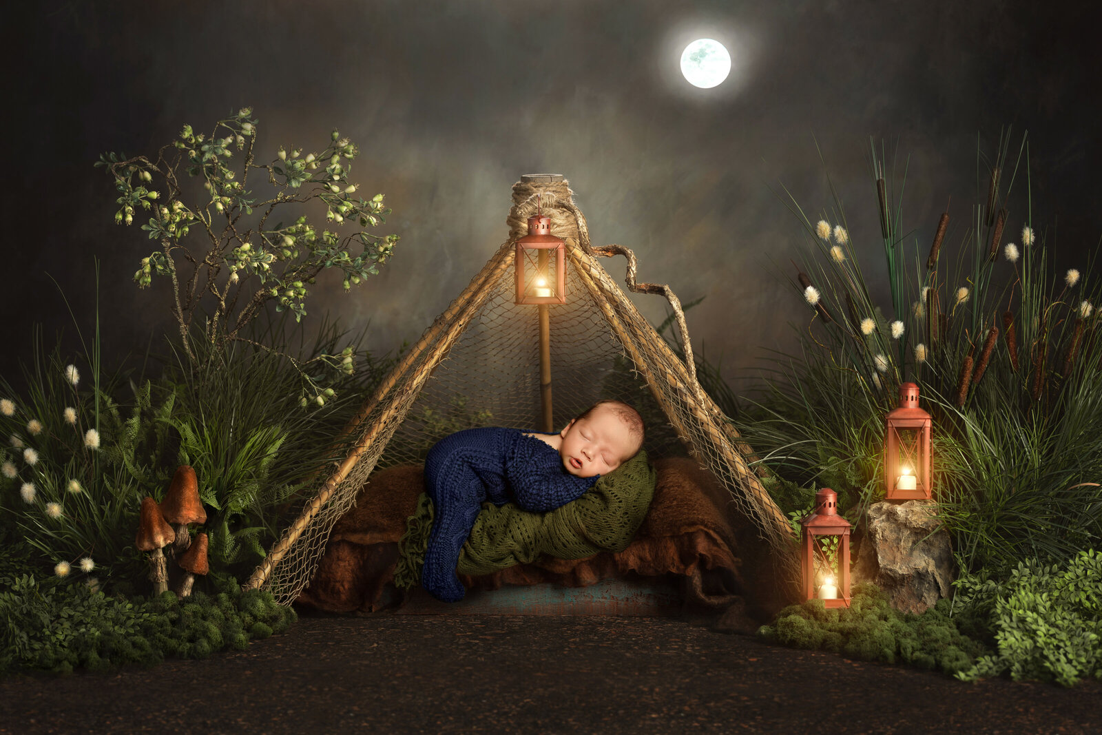 baby in a camping setup photoshoot by newborn photographer in Utah County