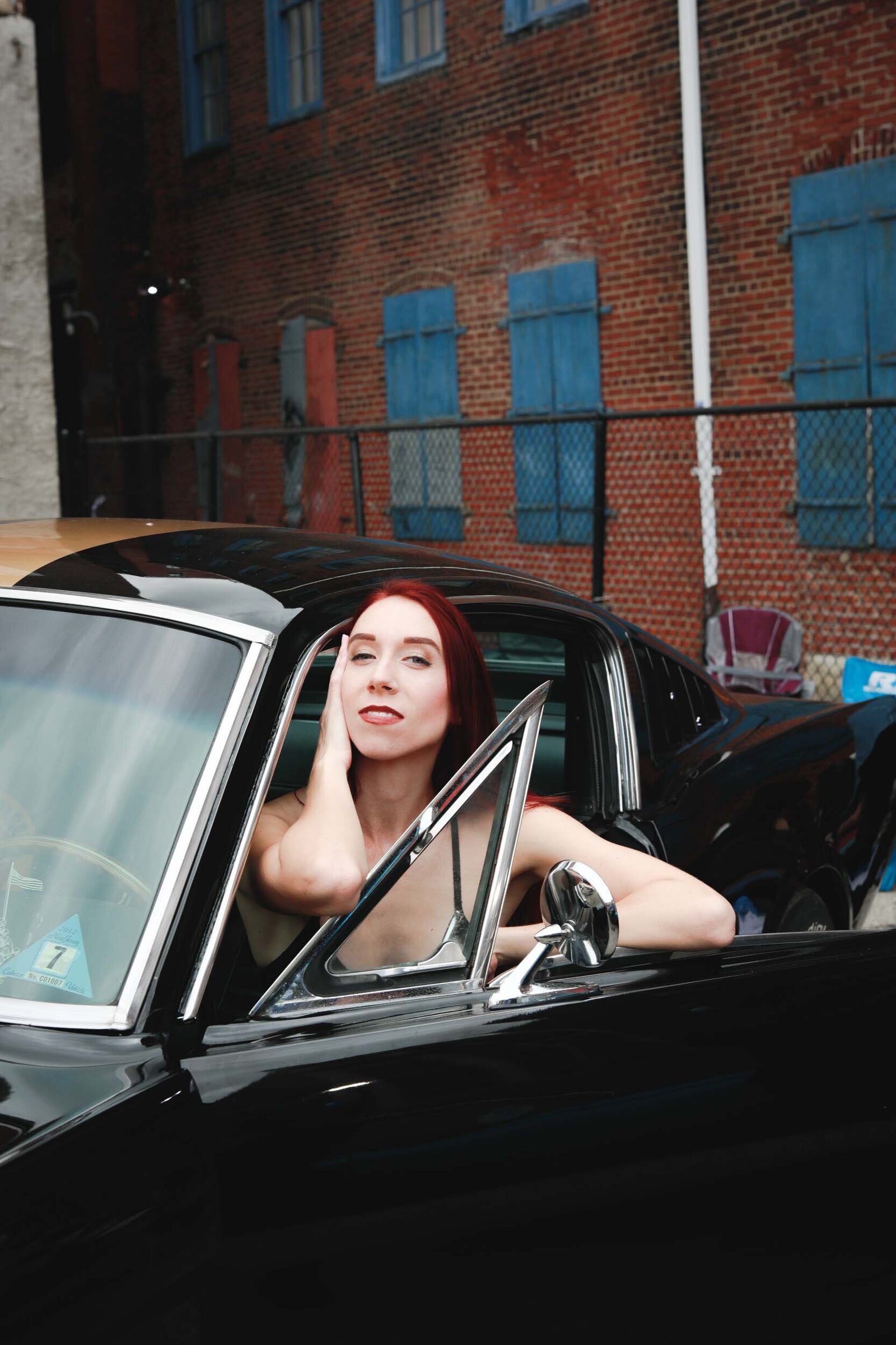 girl-red-hair-black-car-3