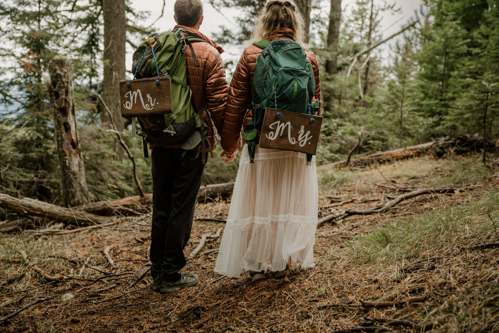 Mr. and m=Mrs. signs on hiking backpack.