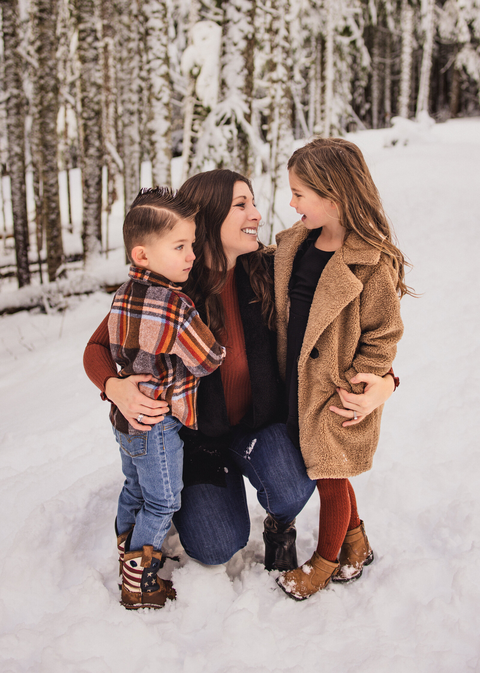 Mom with two kids in the snow on mount hood