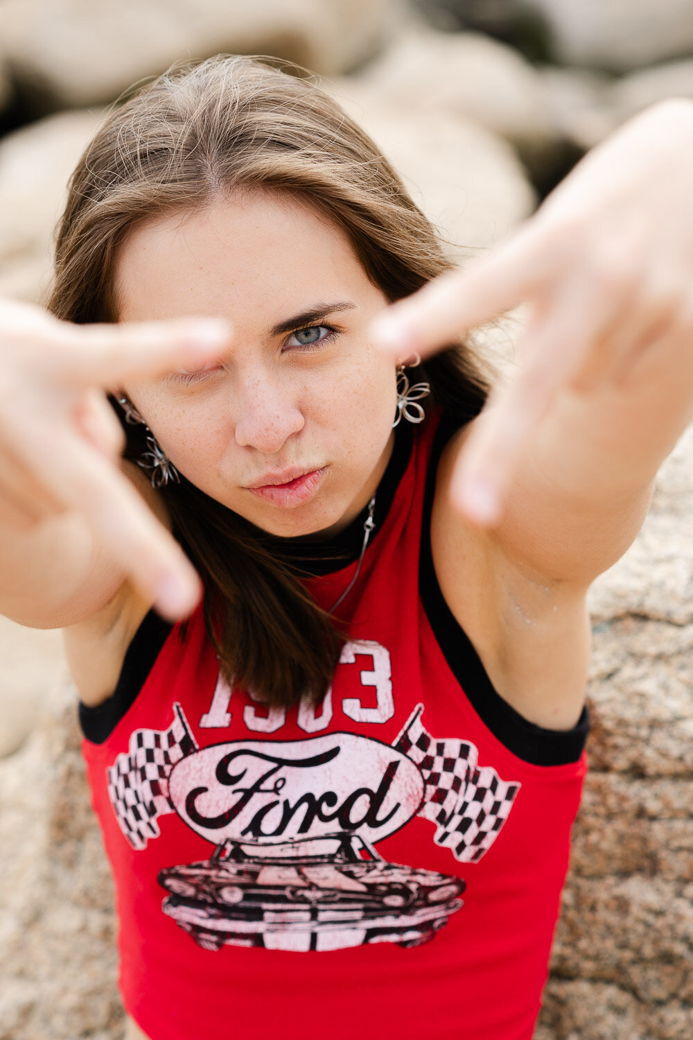 senior girl funny with hand gesture