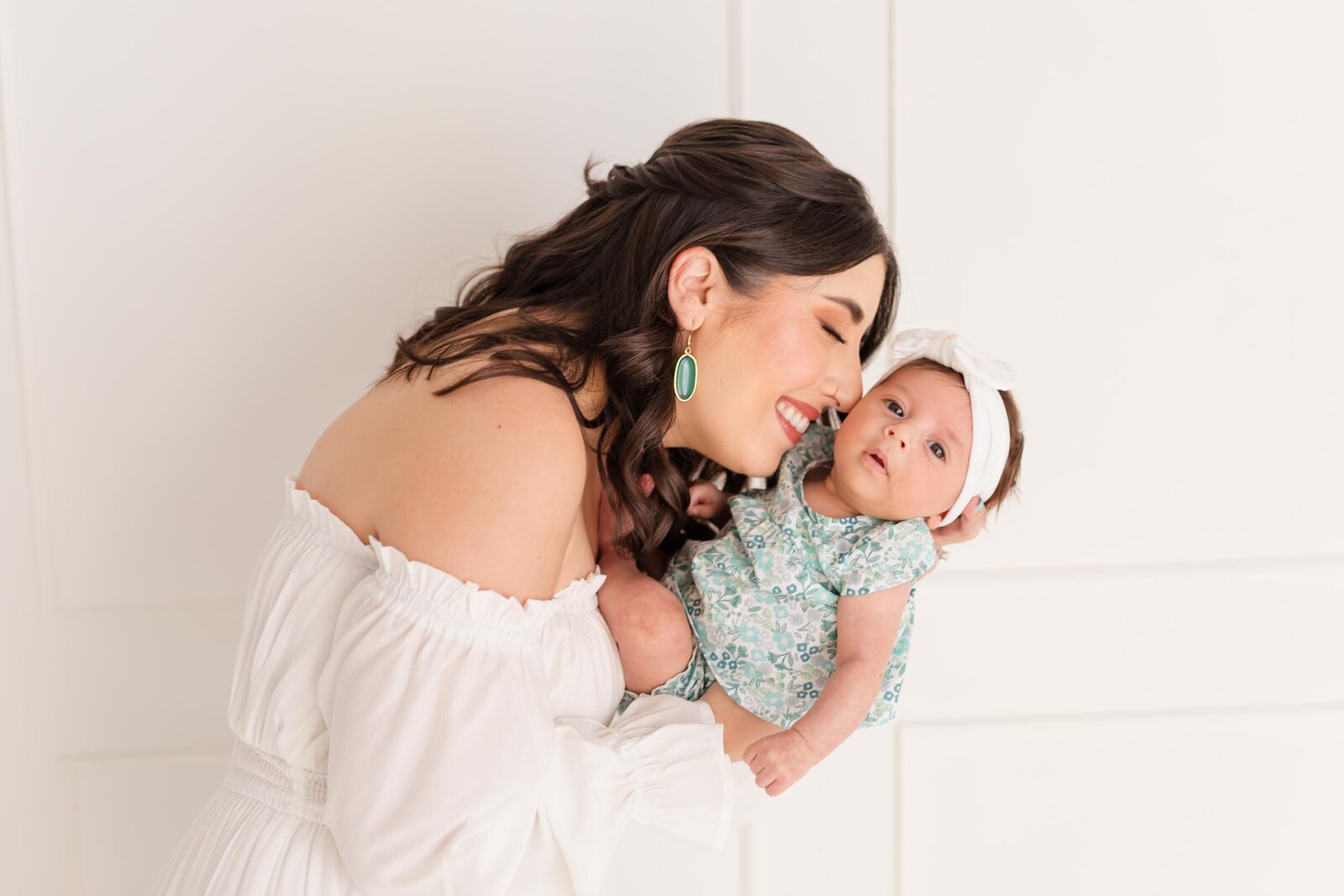 top newborn photographers in orlando with mom and baby girl