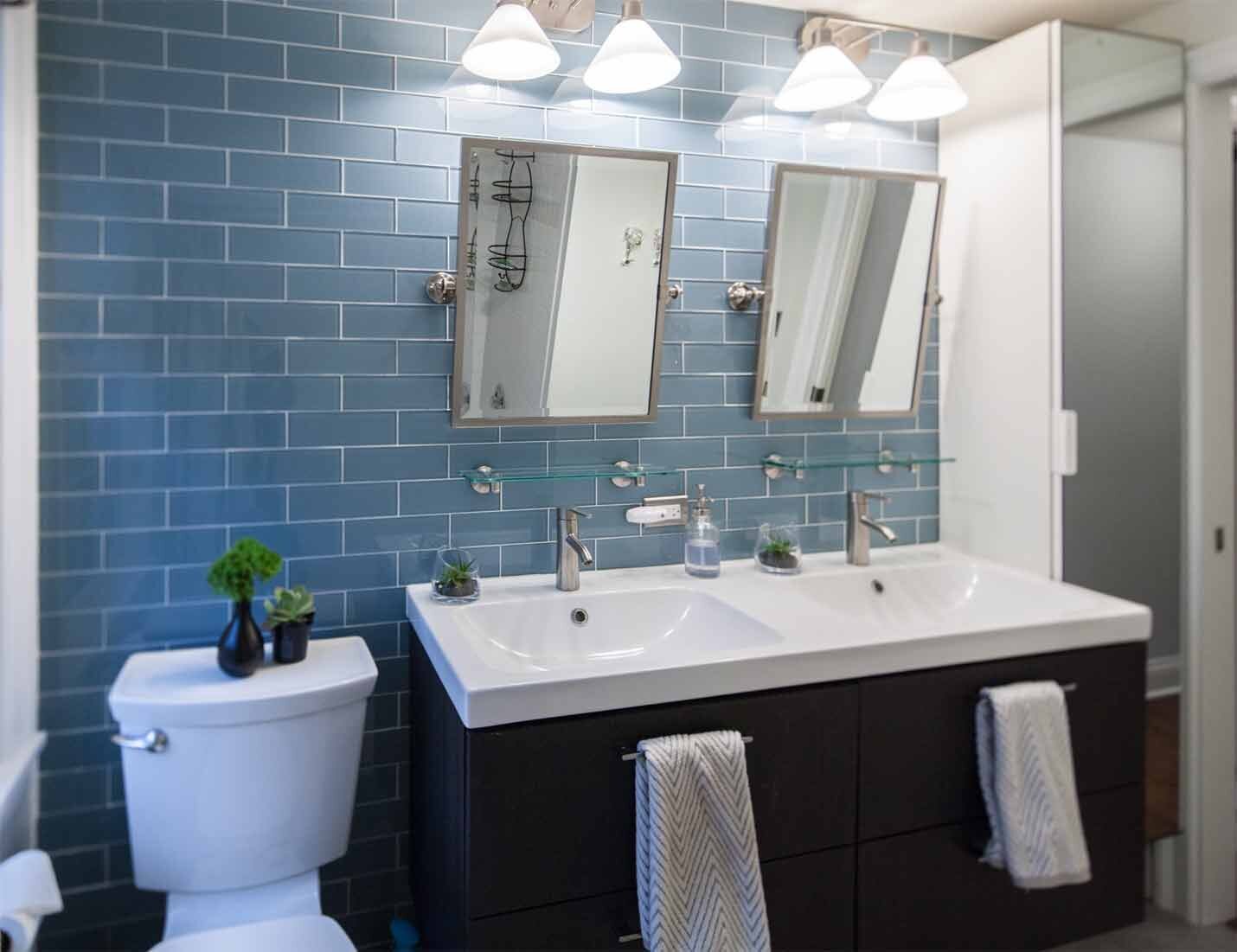 Bathroom design with blue subway tile