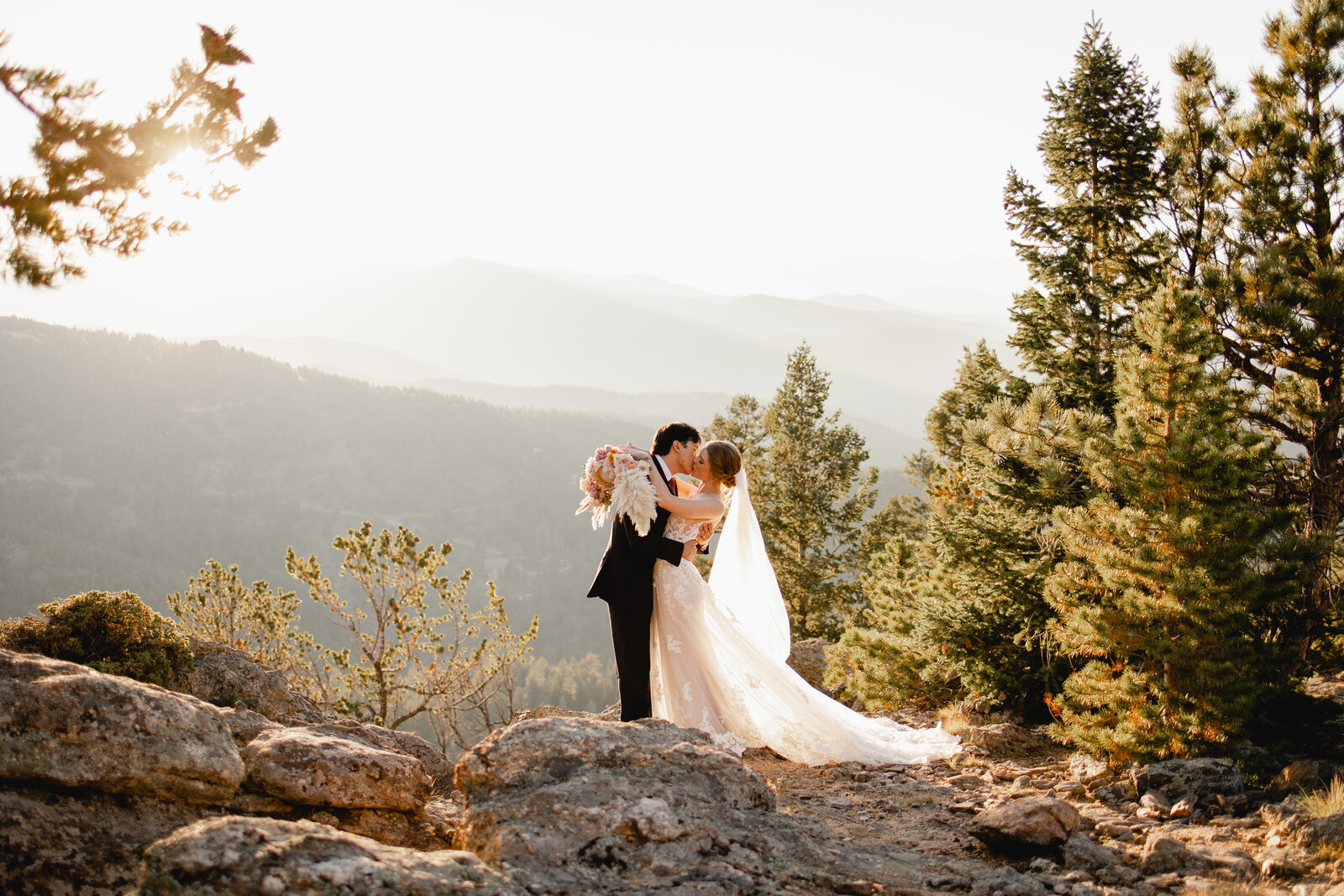couple kissing on wedding day at north star gatherings in idaho springs colorado