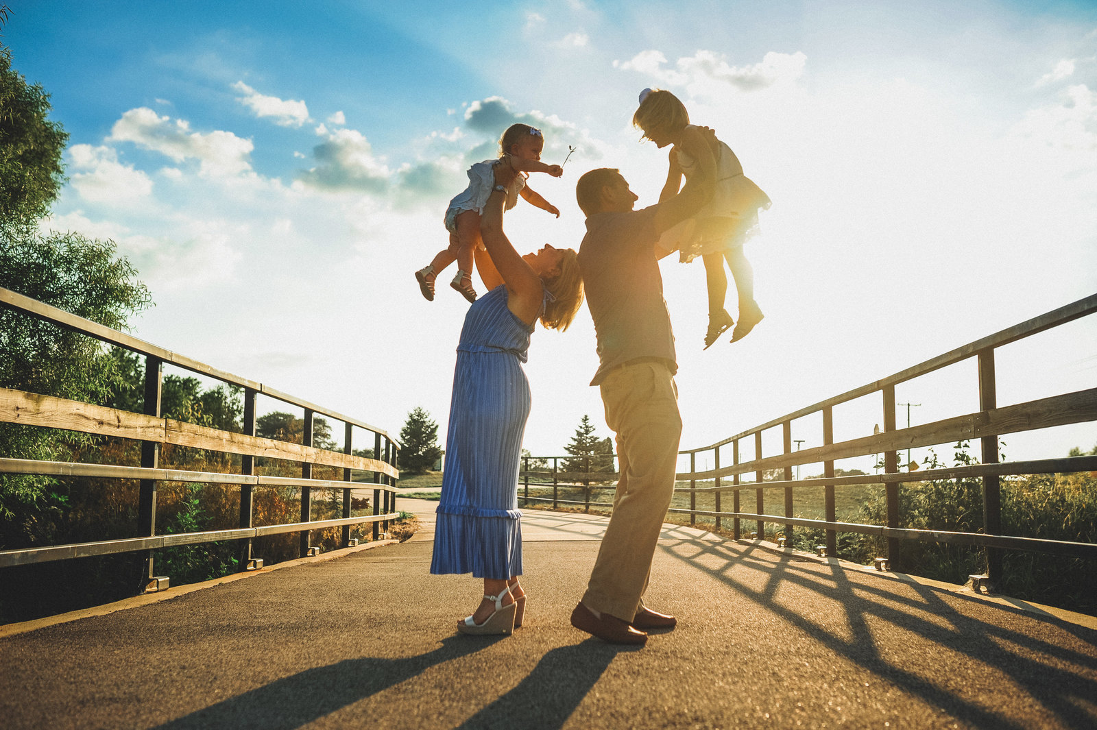 Family portraits with cool sky in Forsyth, IL