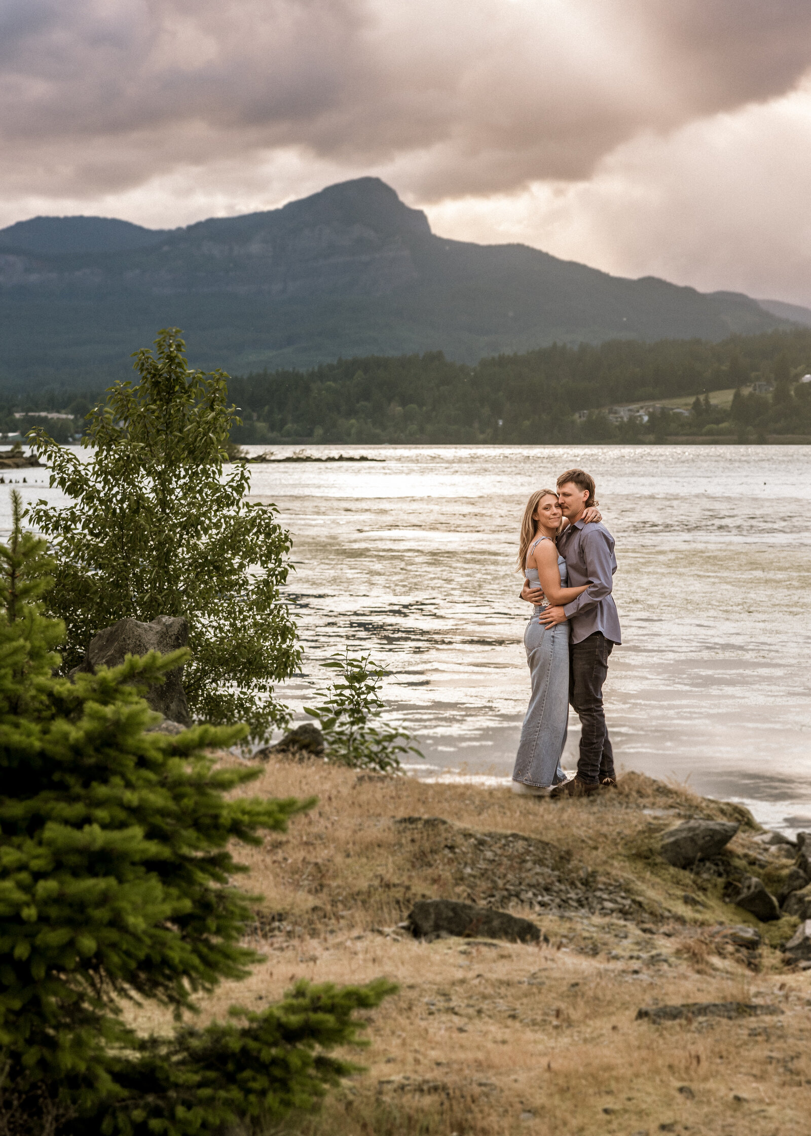 Couple standing on the rocks at Government Cove in the Columbia River Gorge.