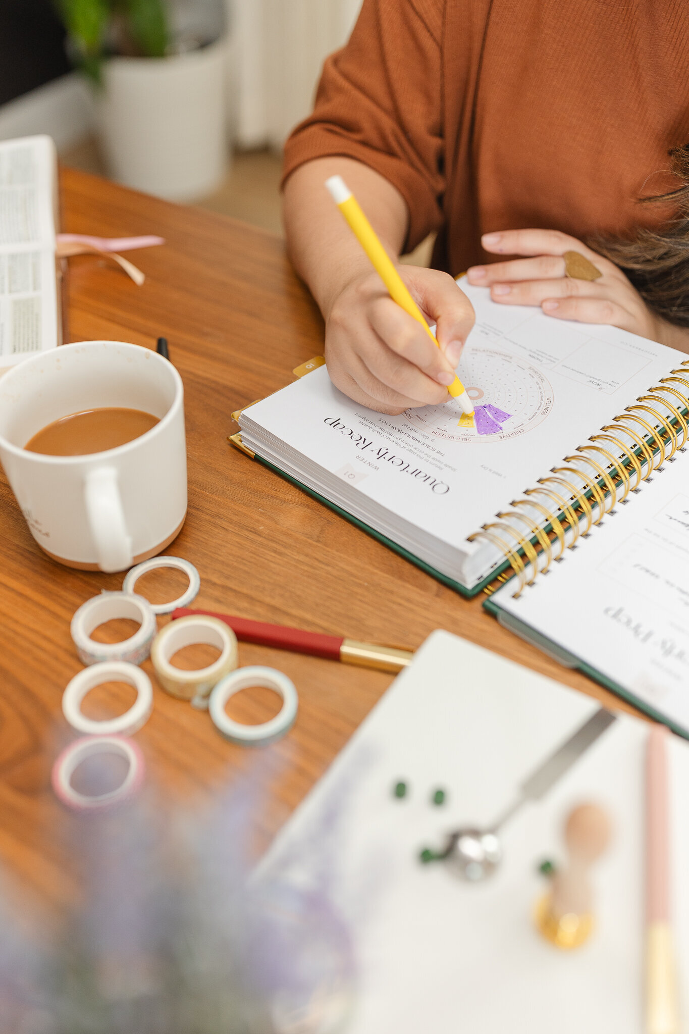 a woman writes in her planner