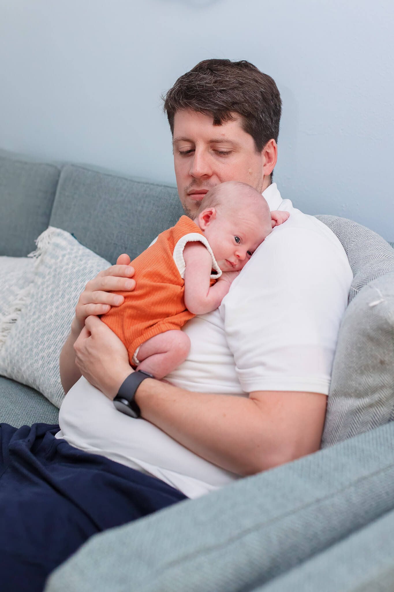 A Burke, Virginia dad holding his newborn son.