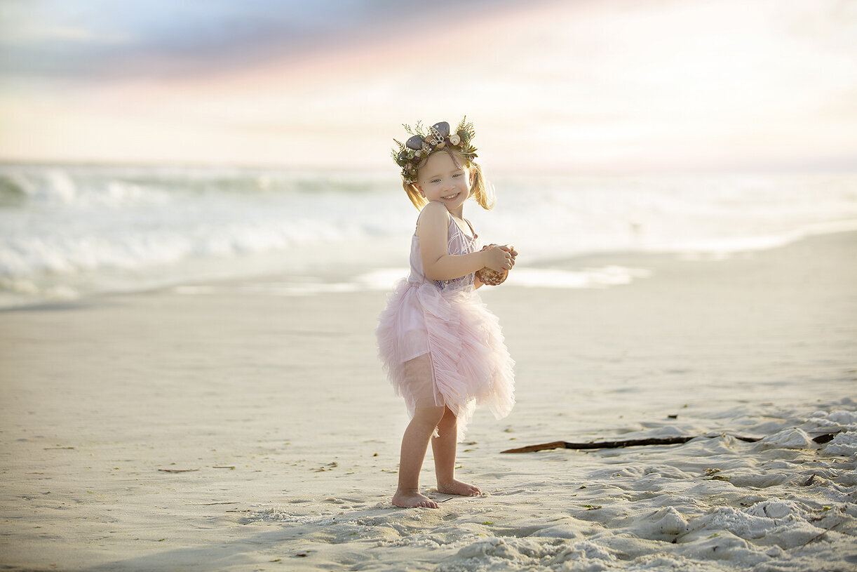 Dallas child photographer photographing children on the beach in Florida.