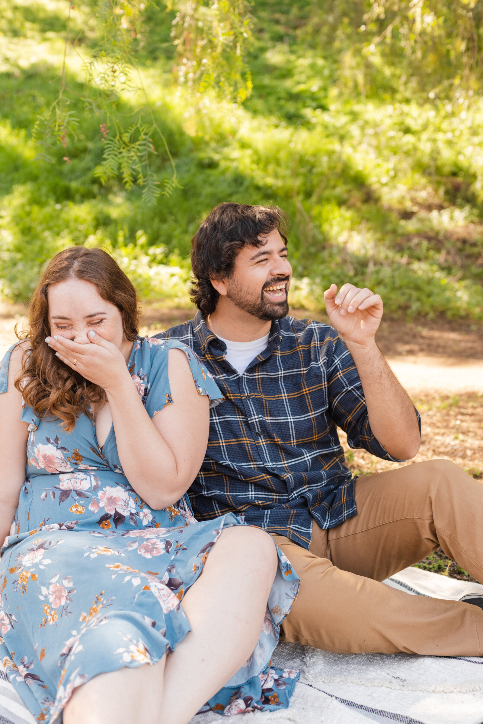 An engaged couple poses for photos in a garden in Los Angeles, Ca.