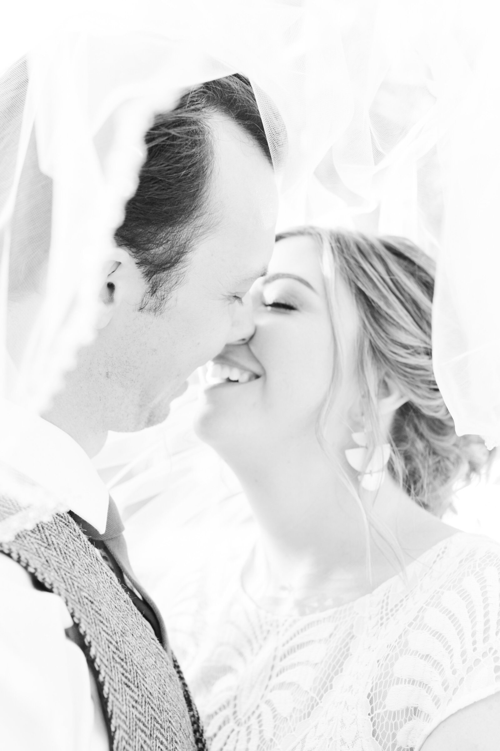 Bride and groom on their colorful wedding day in Santa Cruz, California in the redwood trees.