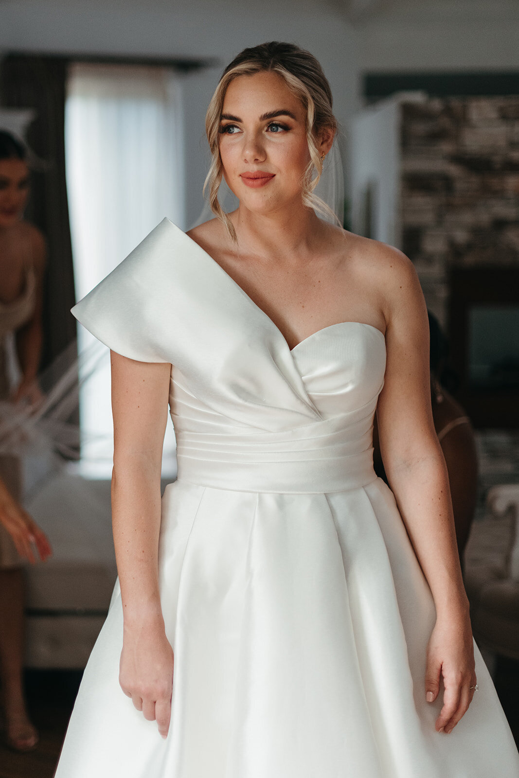Bella Rae Bride Kristen looking  stunning with natural  glam makeup and a textured low bunbat Austinvilla Estate taken by Daniel Chafer Photography