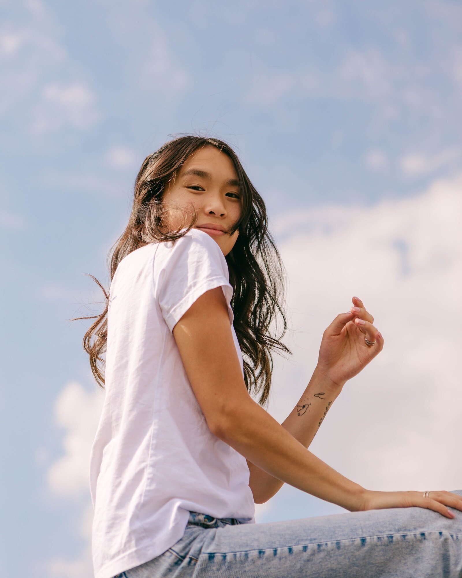 woman-in-white-shirt-smiling-at-the-camera