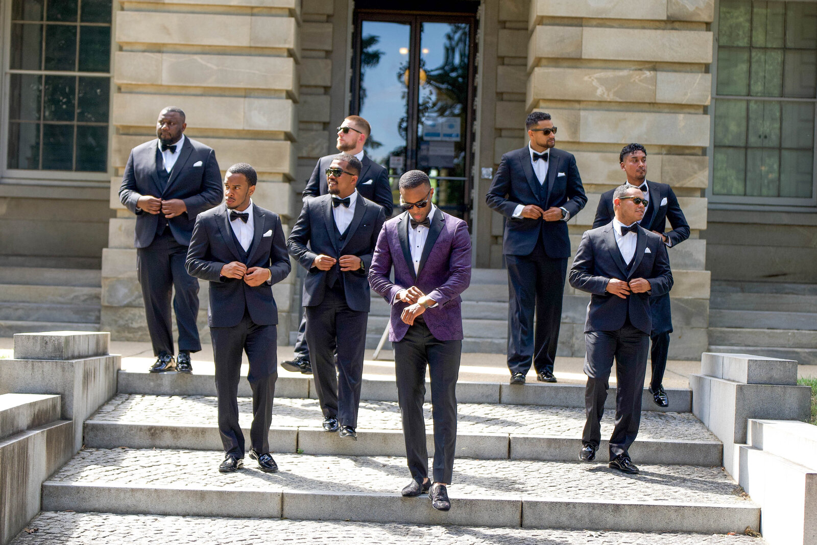 Dapper groom in a custom purple suit, ready for his wedding day in Raleigh, NC.