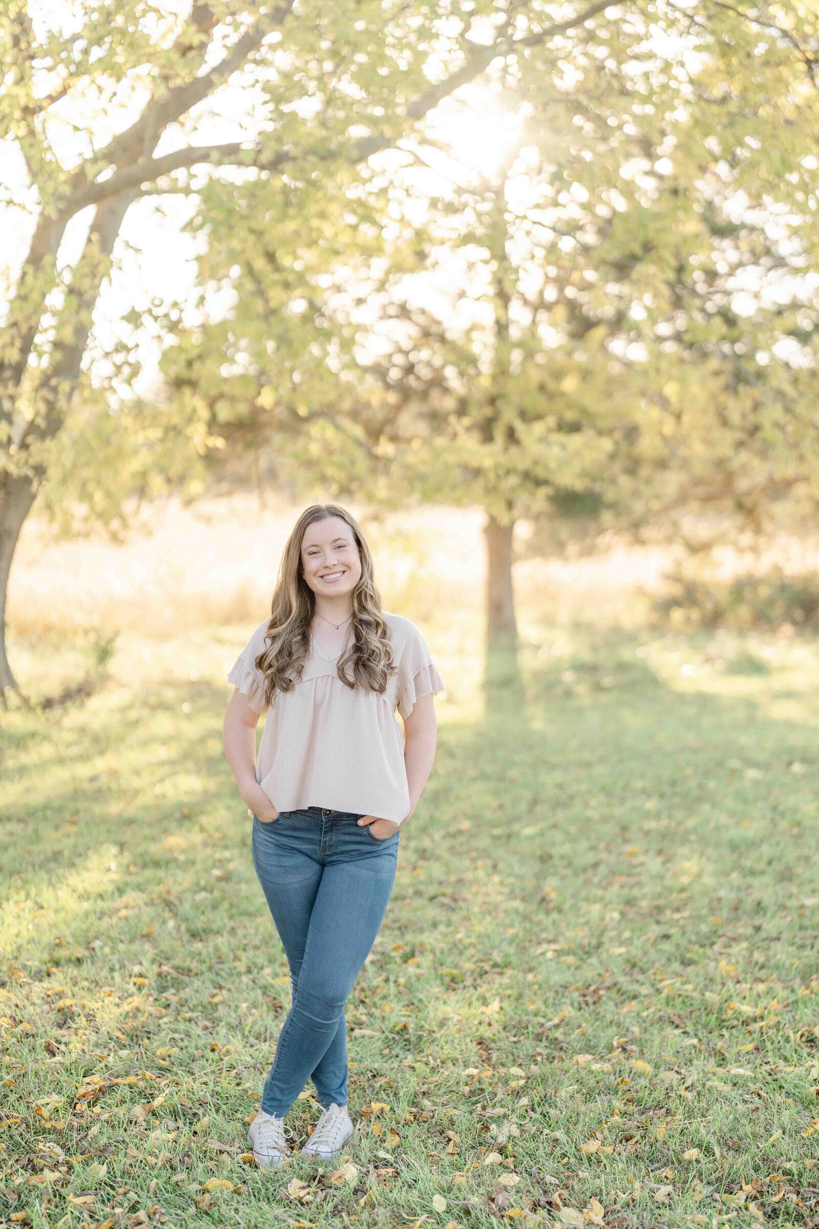high school girl smiling during  senior photo in Ashburn, Virginia