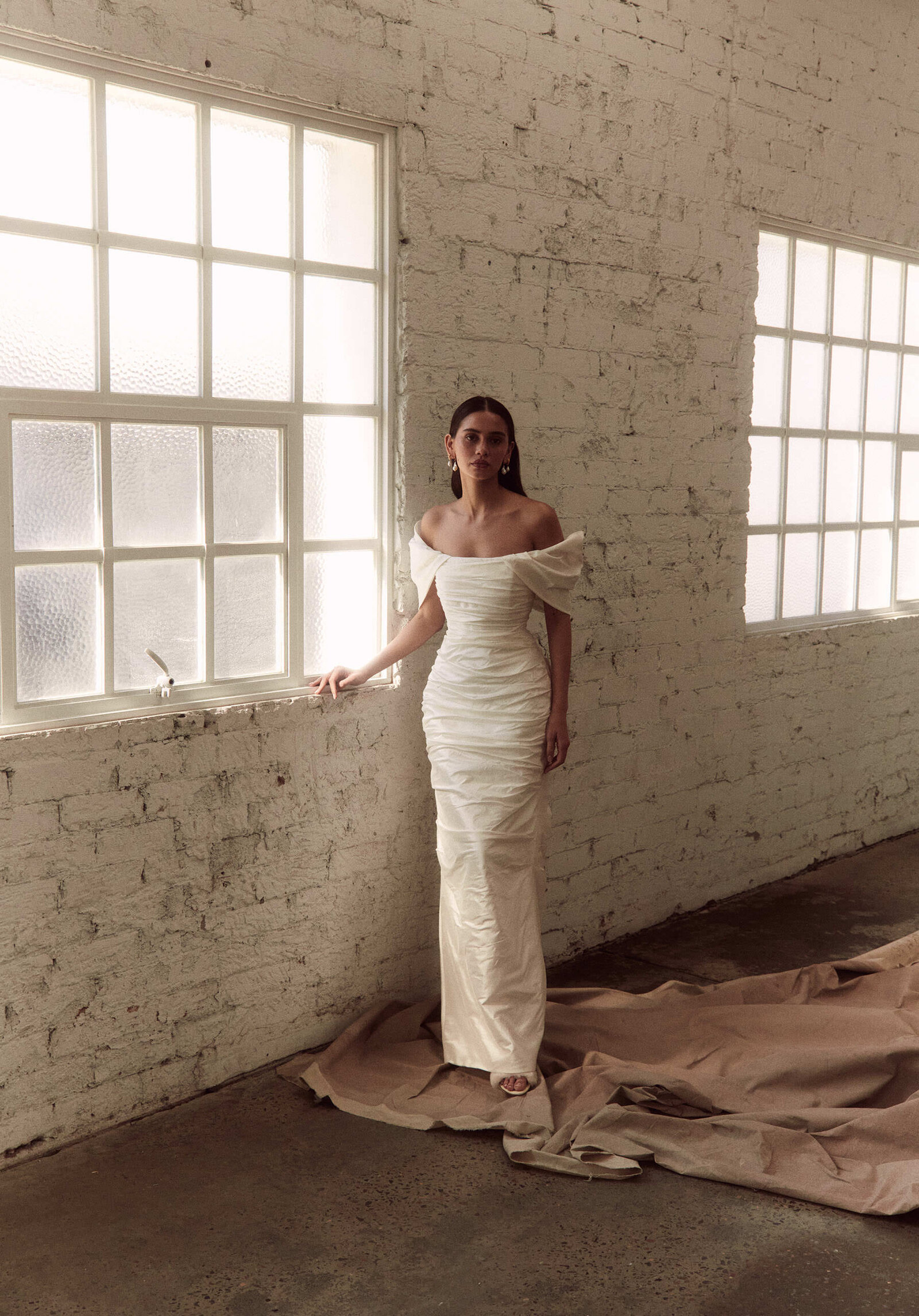 bride wearing white off the shoulder wedding dress