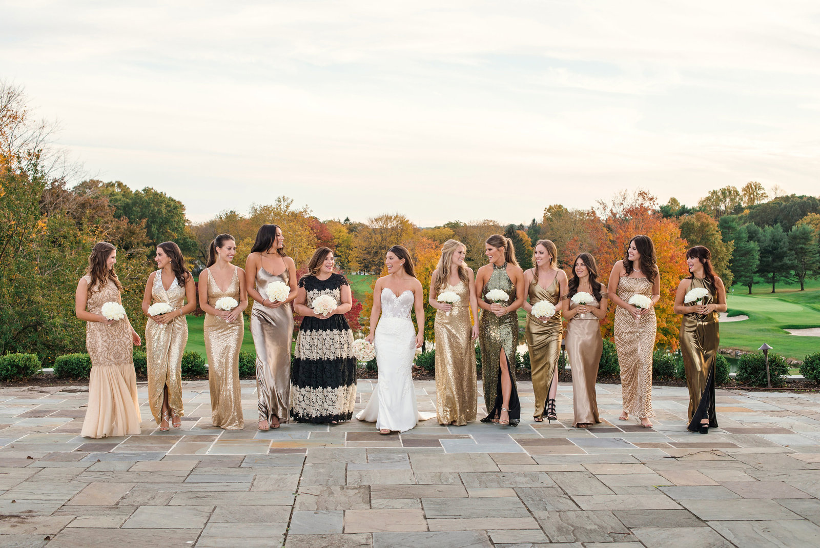 bride and bridesmaids posing outside Glen Head Country Club